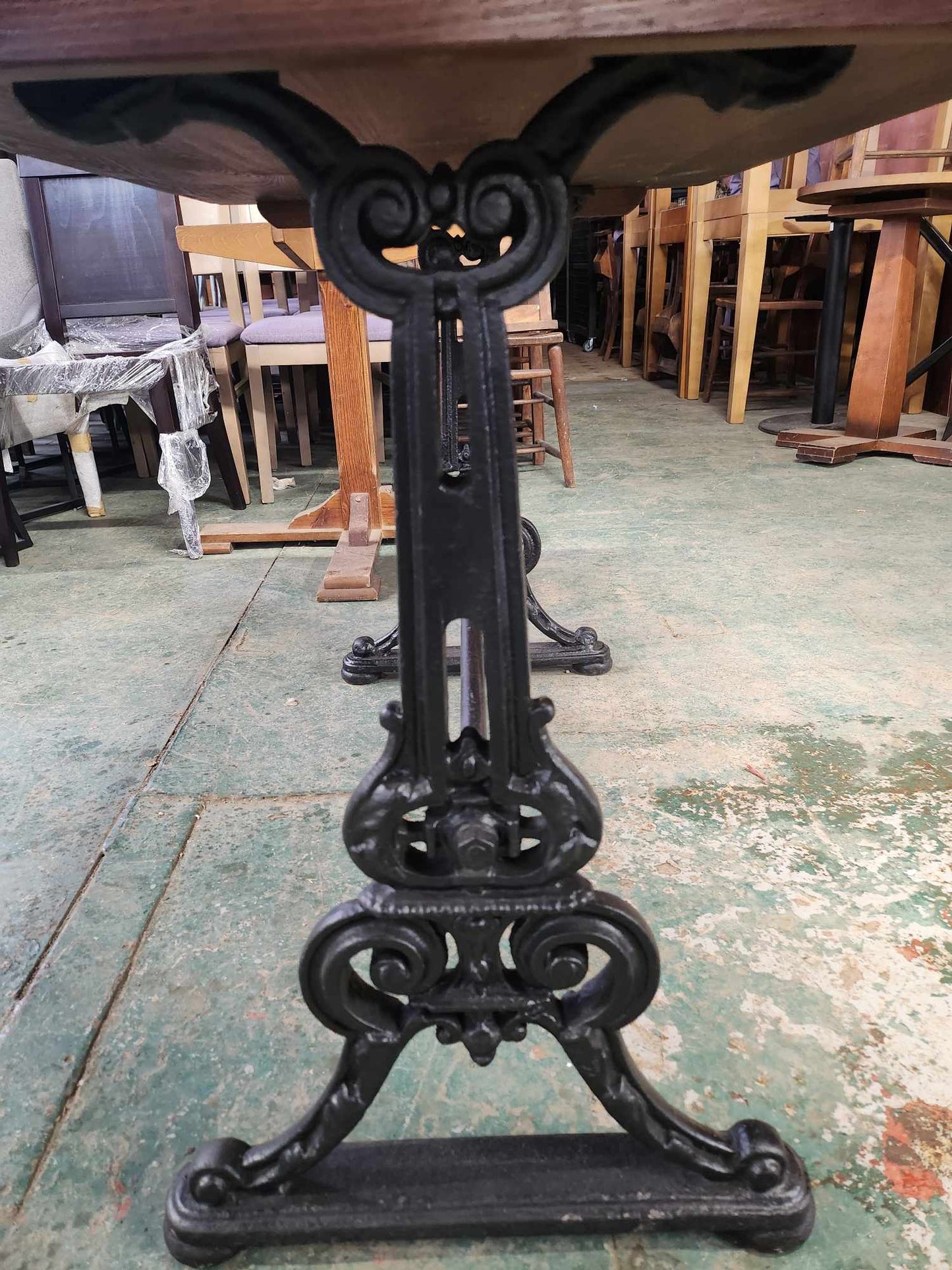 Cast Iron Restaurant Table with Wooden Top and Ornate Legs