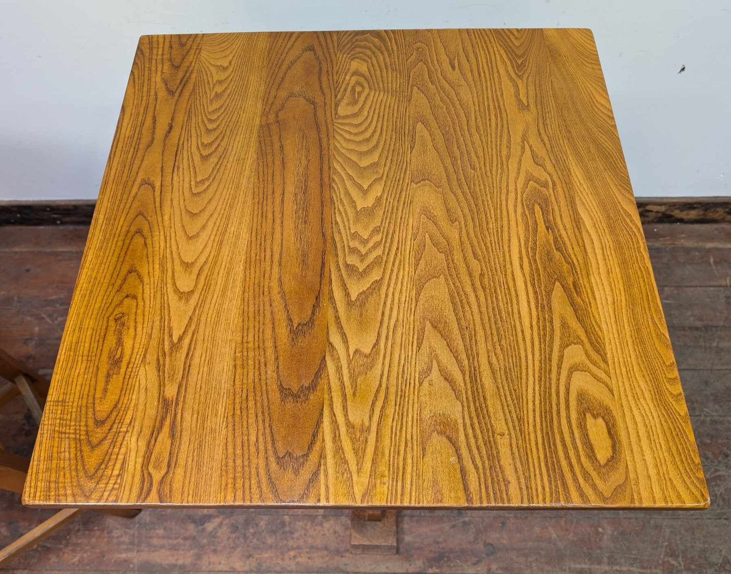 Tall Square Poseur Table with Two Patterned Bar Stools and Light Wood Finish