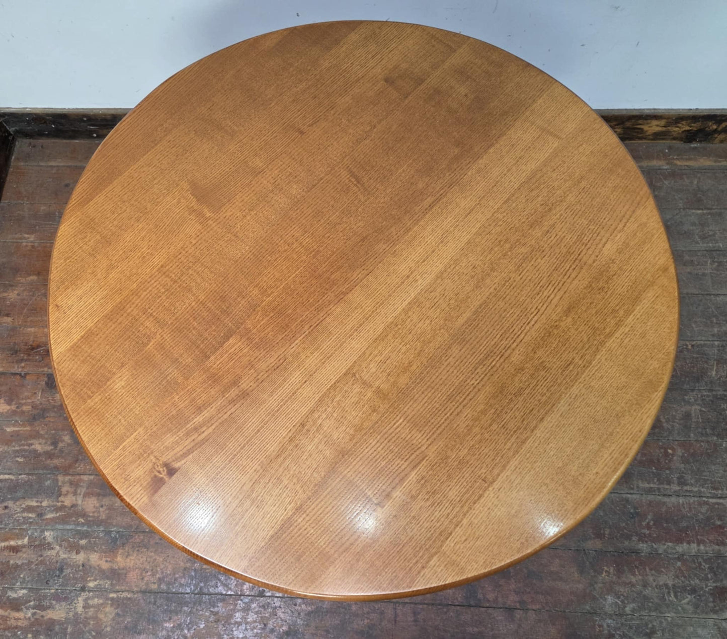 Medium Round Dining Table with Ornate Cast Iron Base and Light Wood Top
