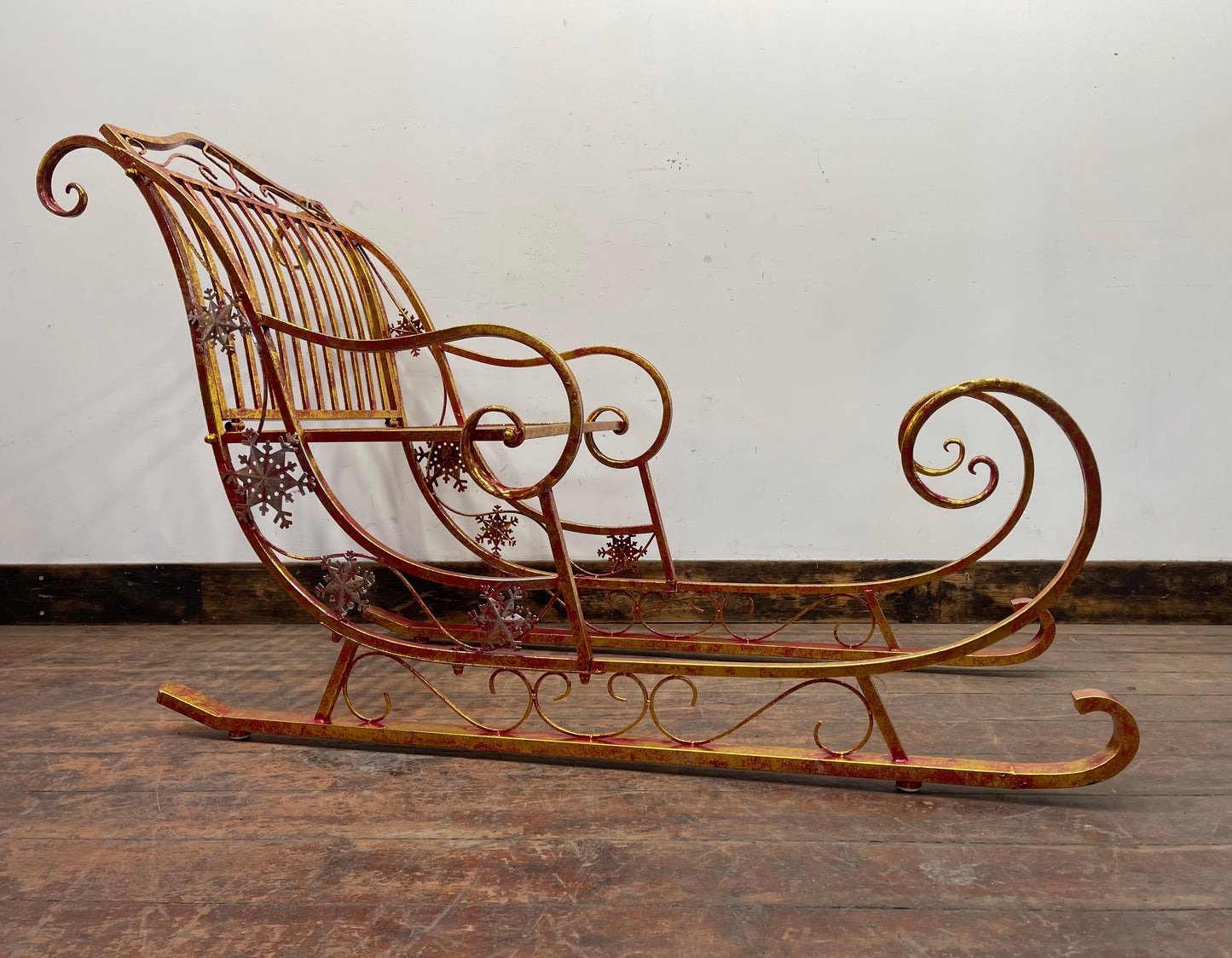 Red and gold Christmas sleigh including reindeer figure