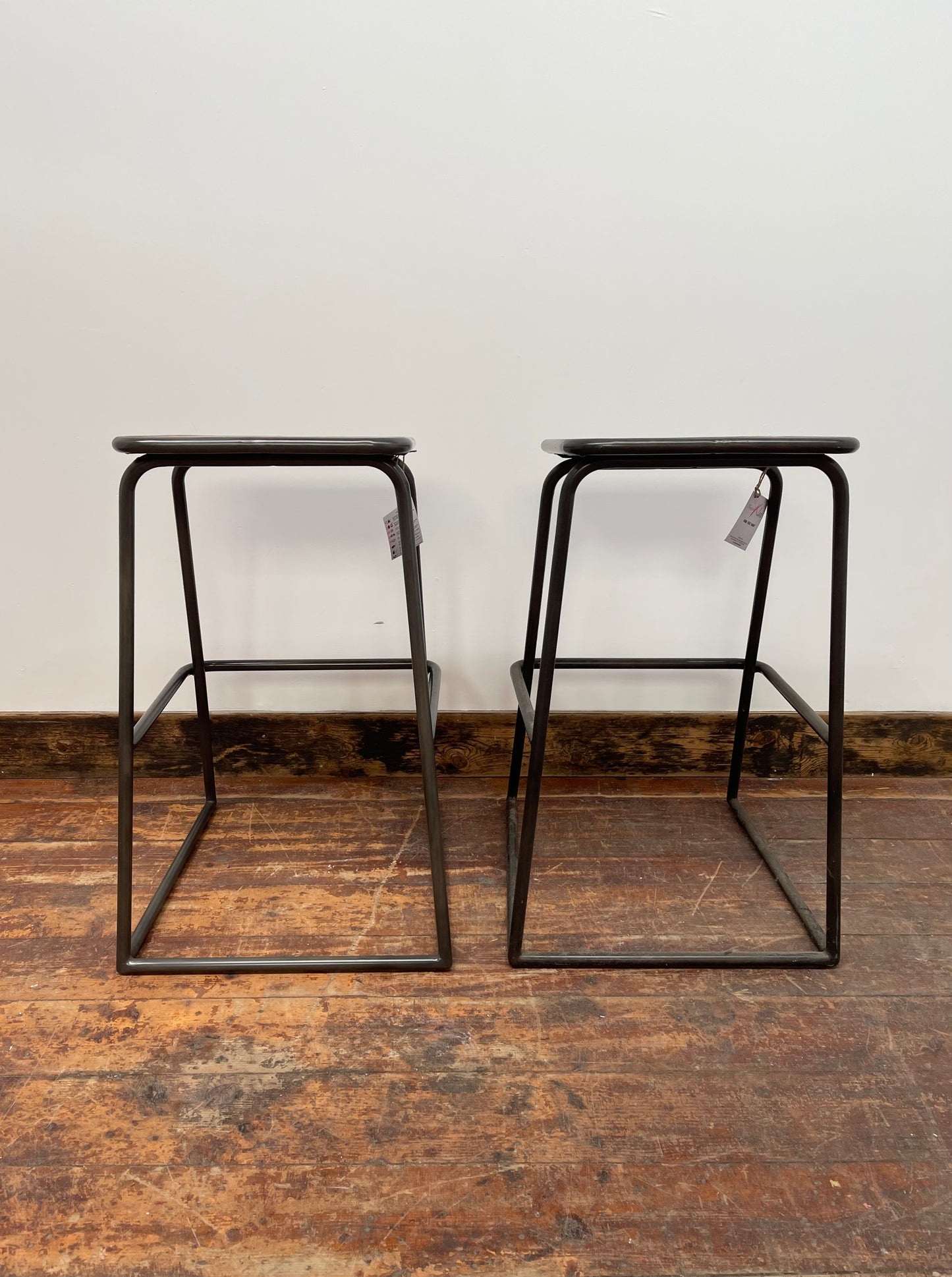 Industrial style bar stools with tilted seats