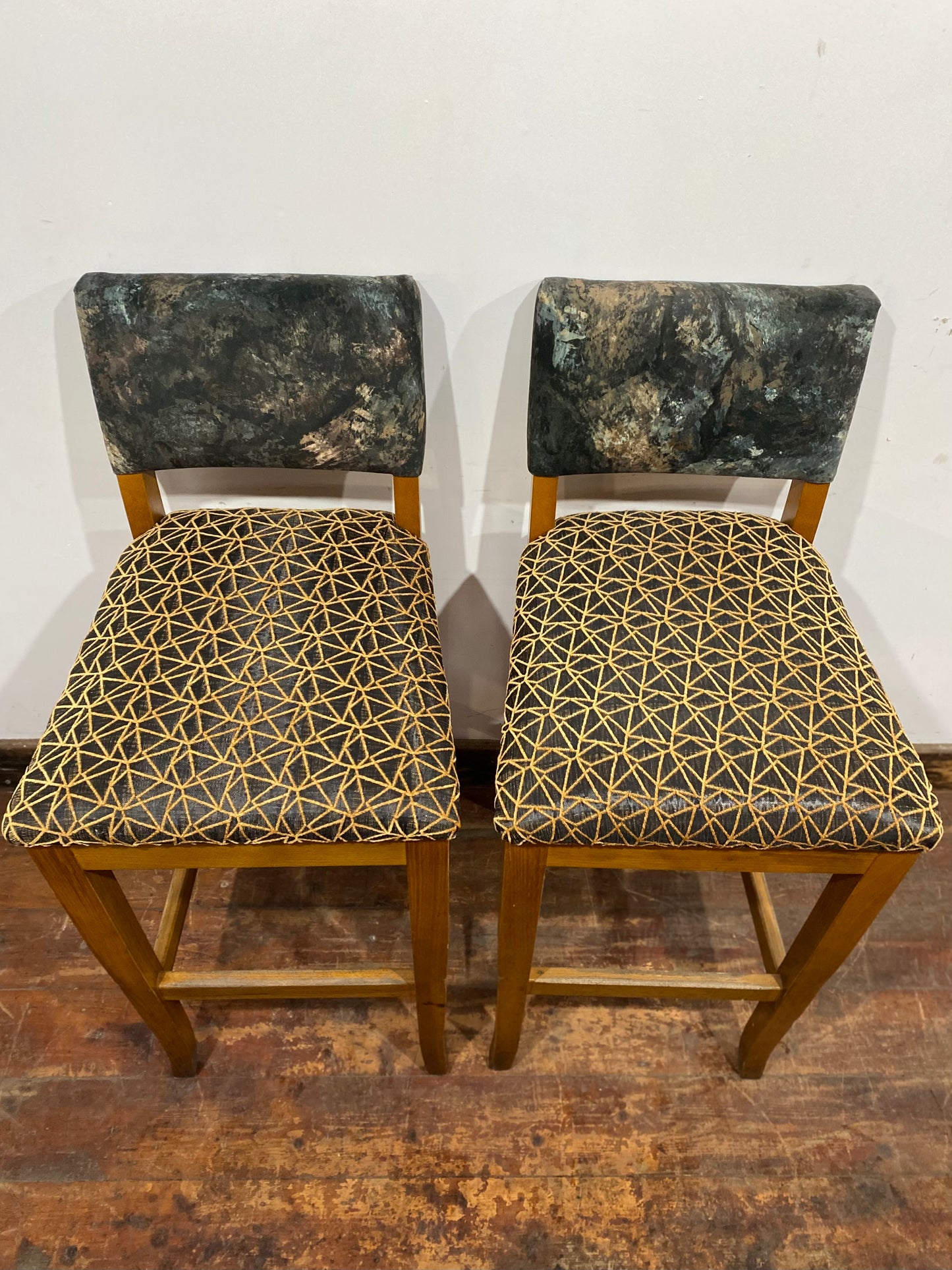 Tall Square Poseur Table with Two Patterned Bar Stools and Light Wood Finish