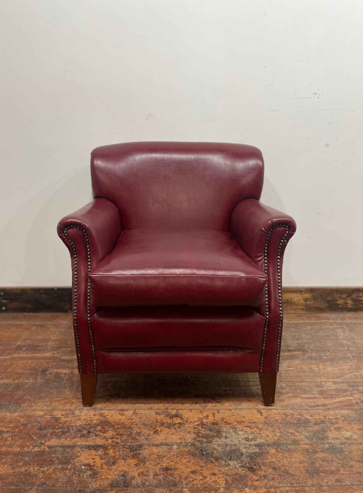 Retro style red leather-effect armchair