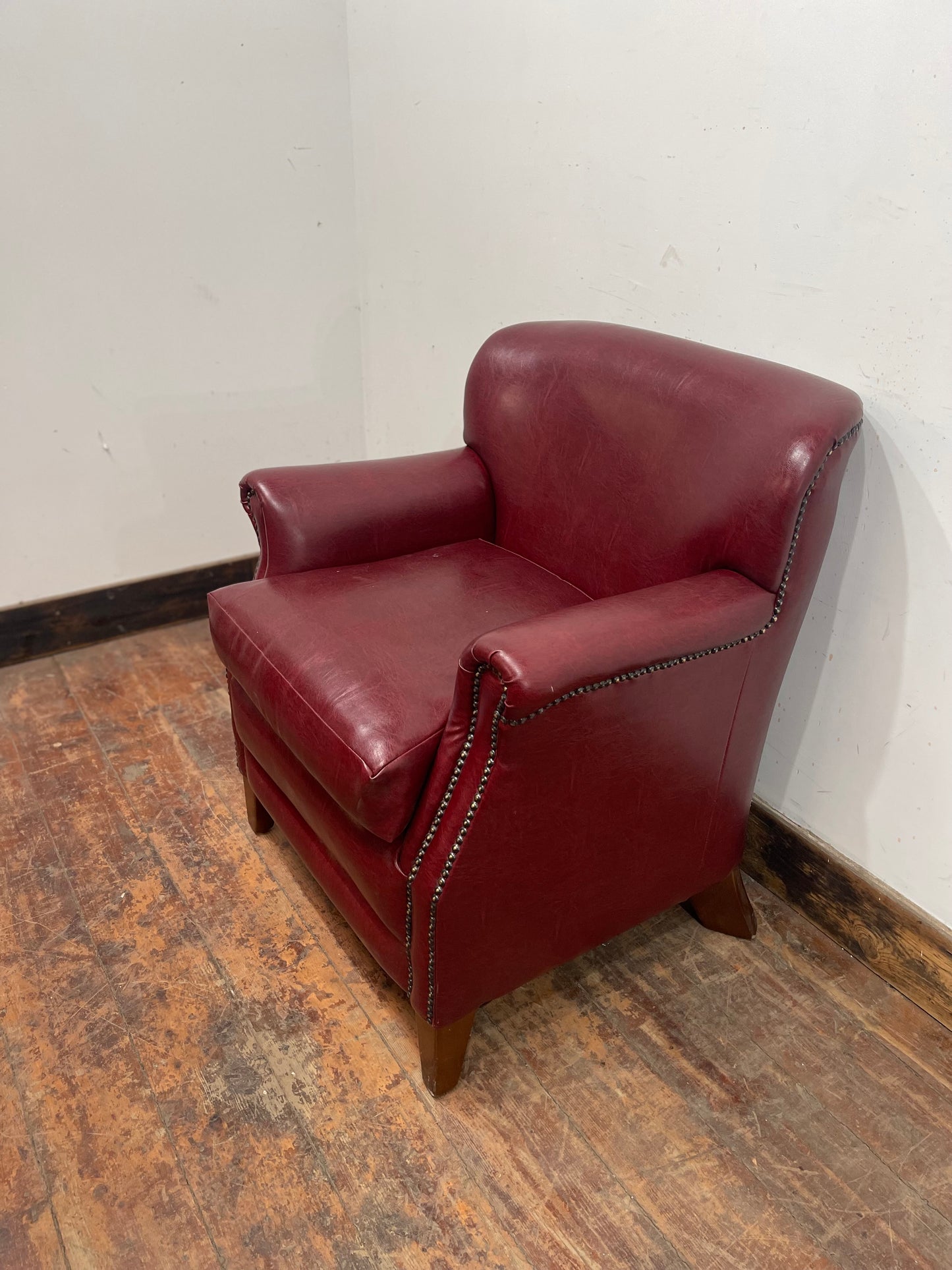 Retro style red leather-effect armchair