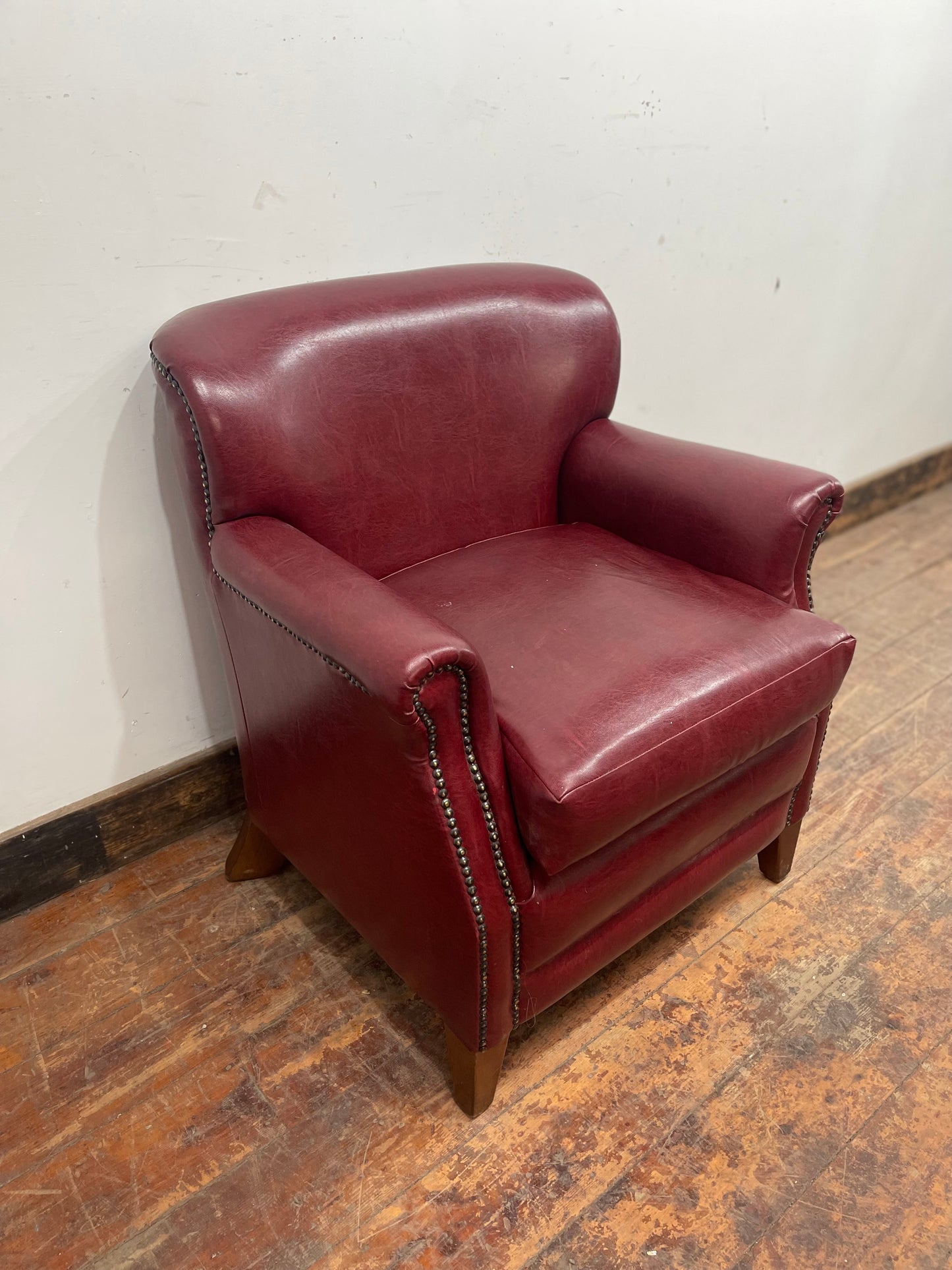 Retro style red leather-effect armchair