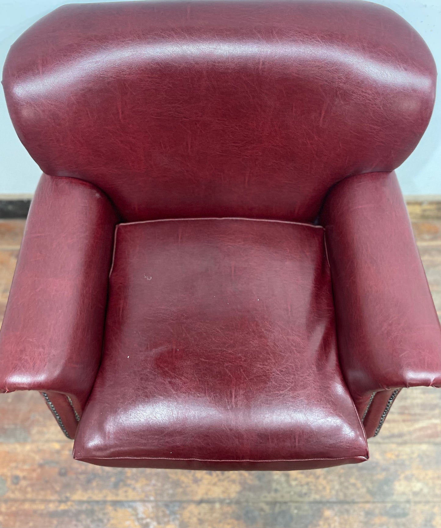 Retro style red leather-effect armchair