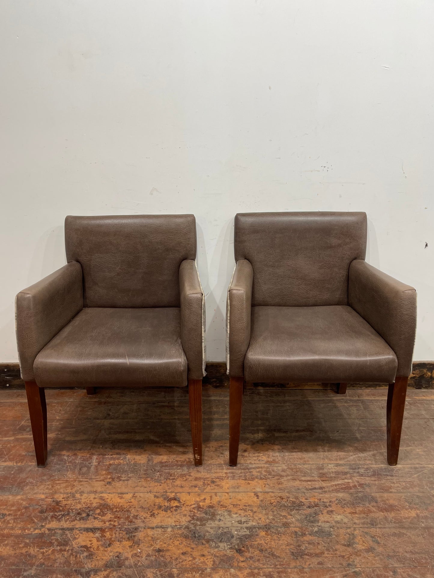 Pair of leather-effect armchairs / pub chairs with check tartan backs