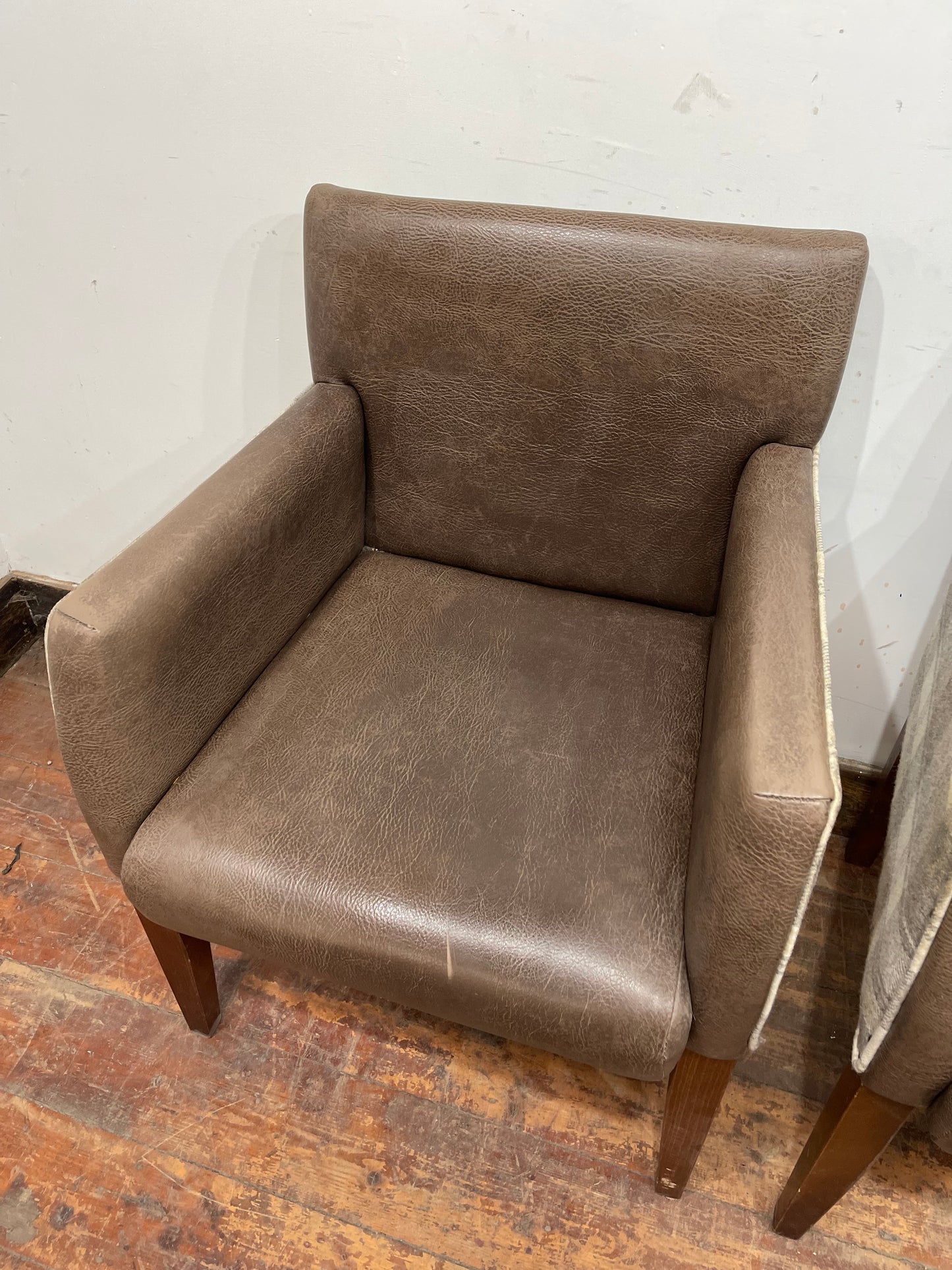 Pair of leather-effect armchairs / pub chairs with check tartan backs