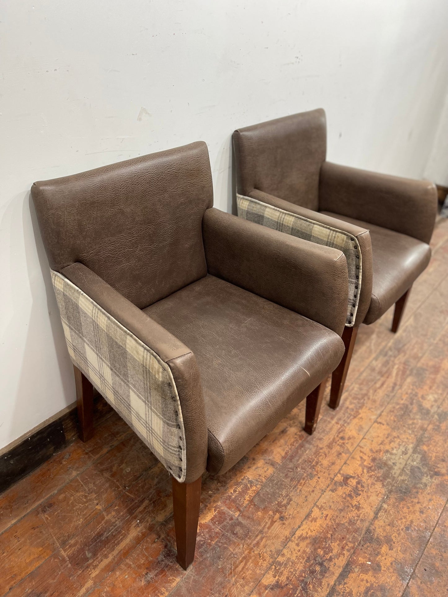 Pair of leather-effect armchairs / pub chairs with check tartan backs