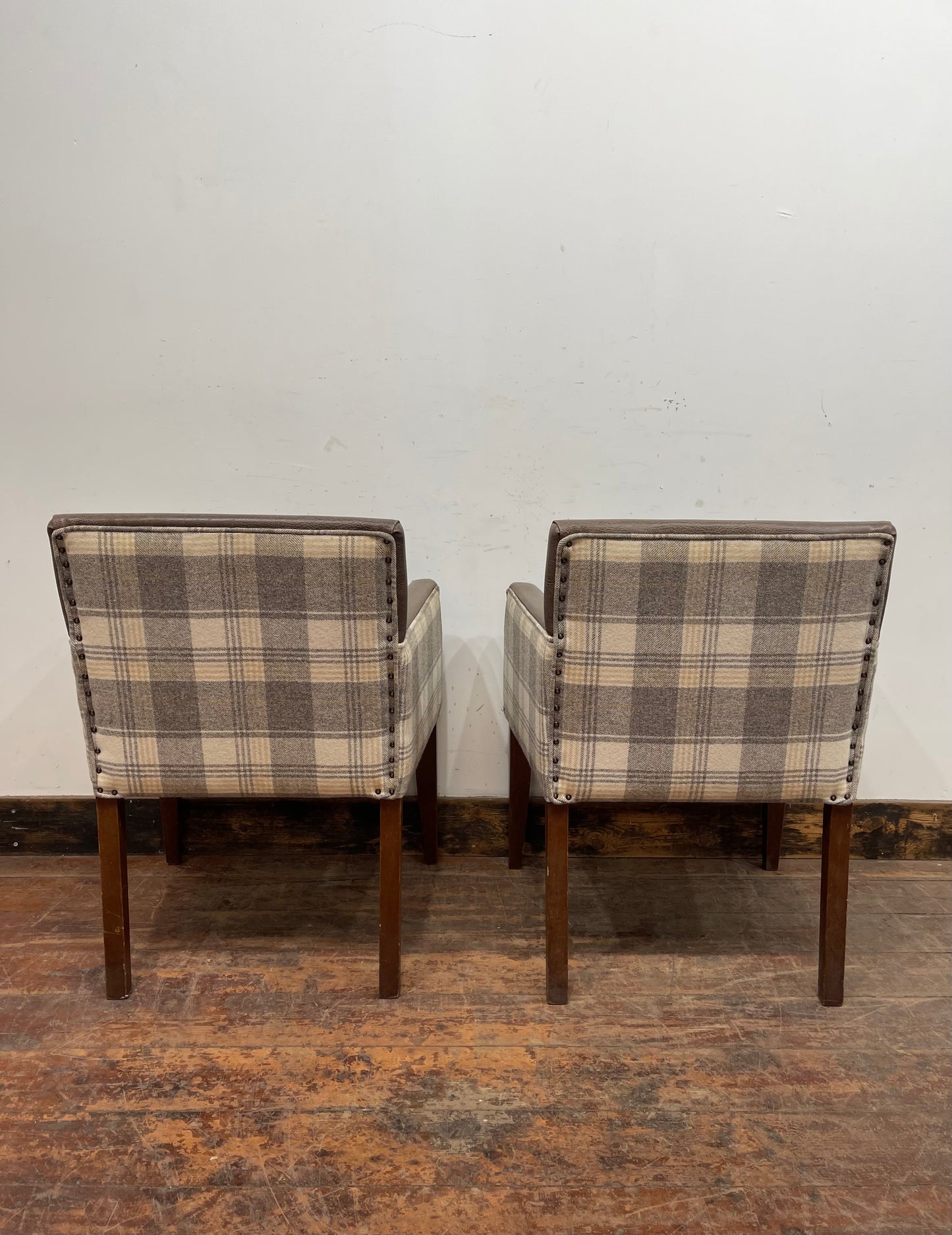 Pair of leather-effect armchairs / pub chairs with check tartan backs