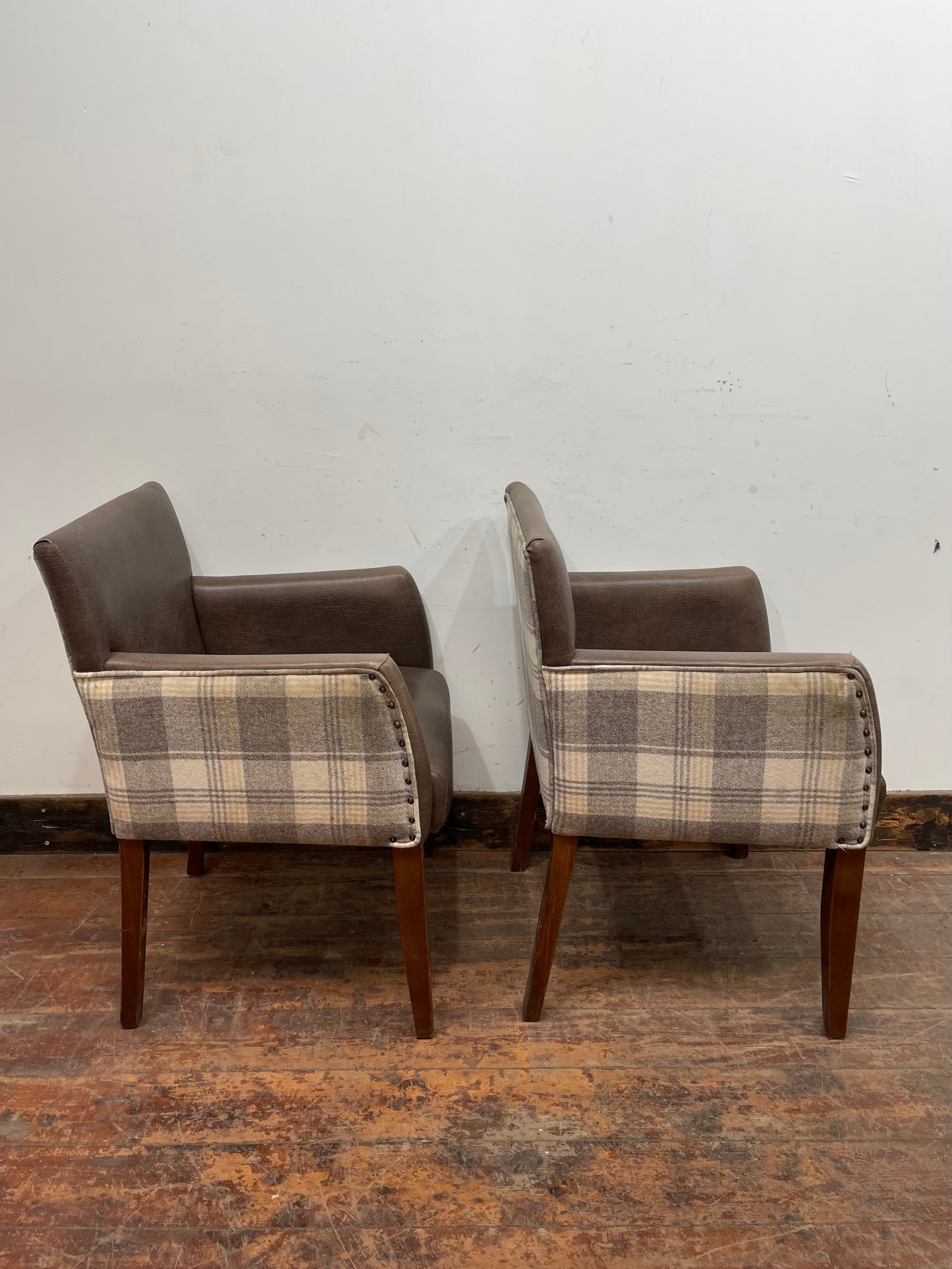 Pair of leather-effect armchairs / pub chairs with check tartan backs