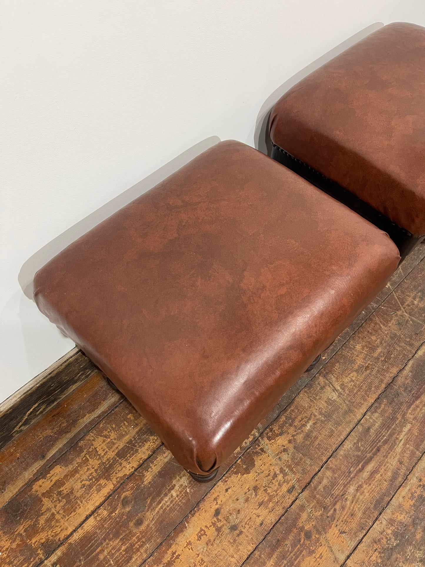 Pair of low pub stools in tan coloured faux-leather