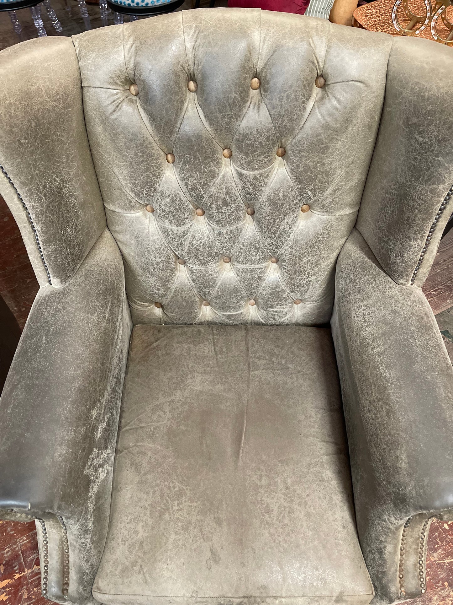 Grey Chesterfield style wingback armchair
