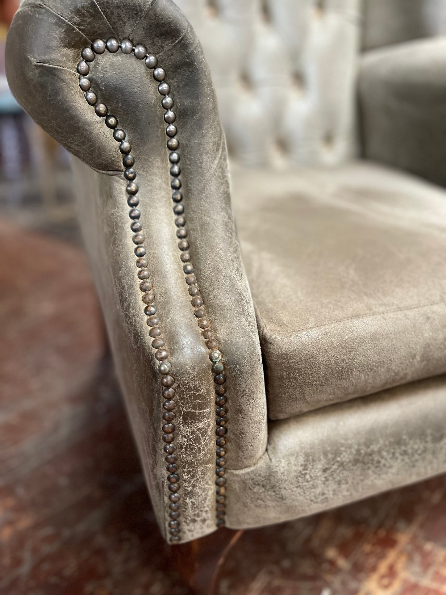 Grey Chesterfield style wingback armchair
