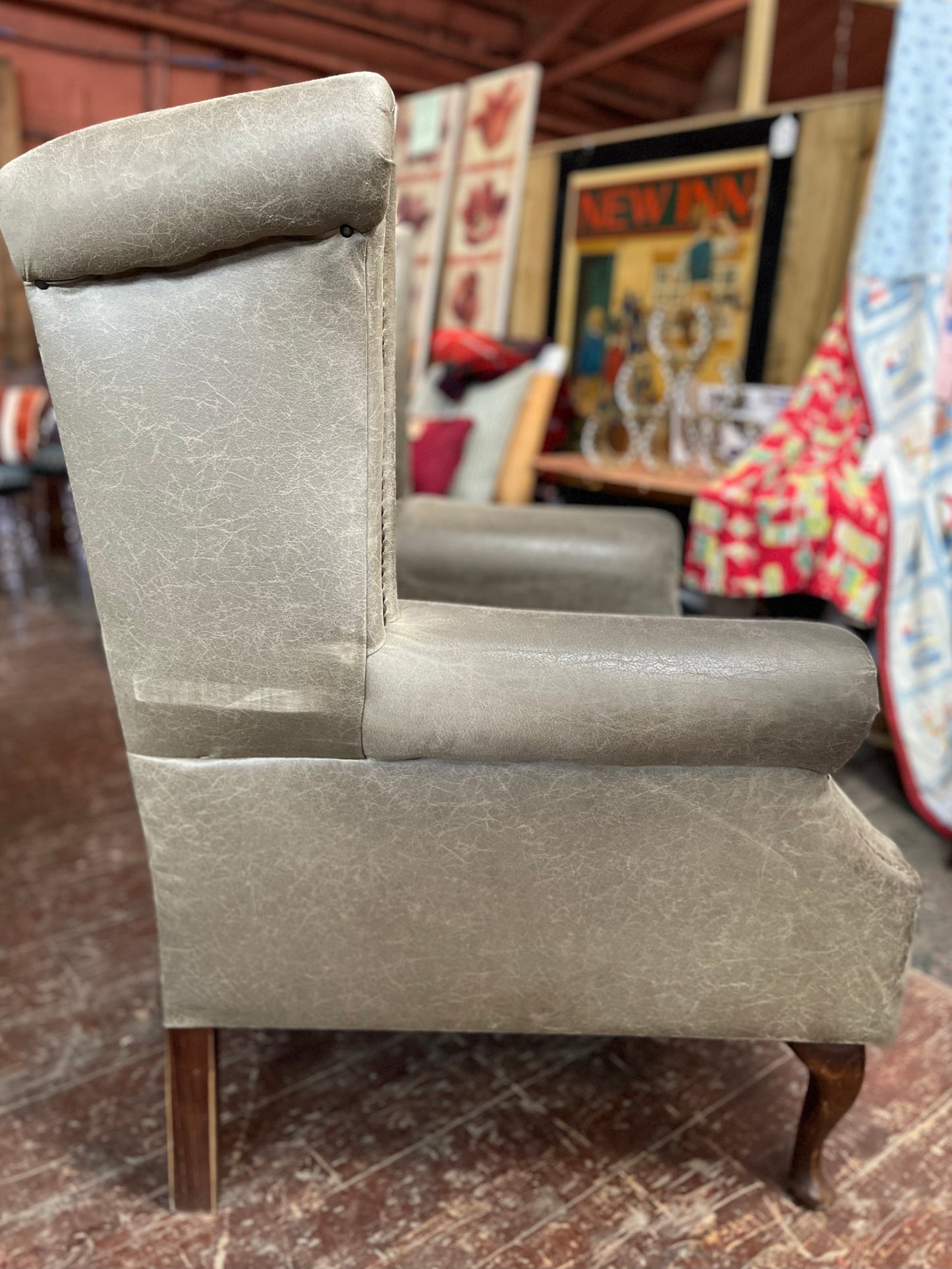 Grey Chesterfield style wingback armchair