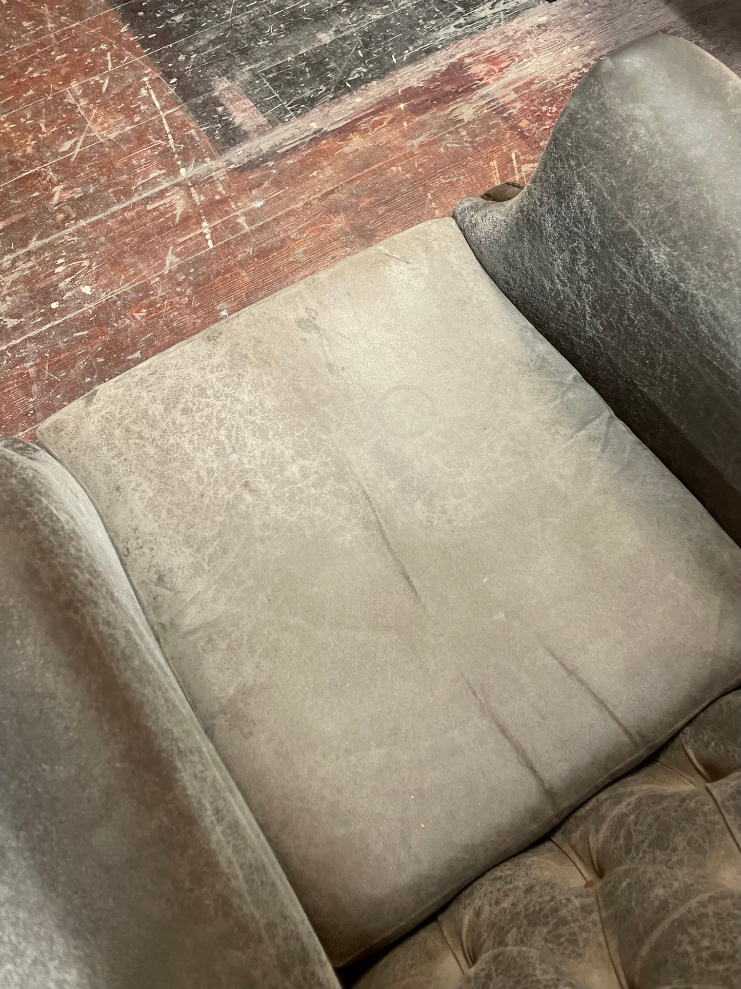 Grey Chesterfield style wingback armchair