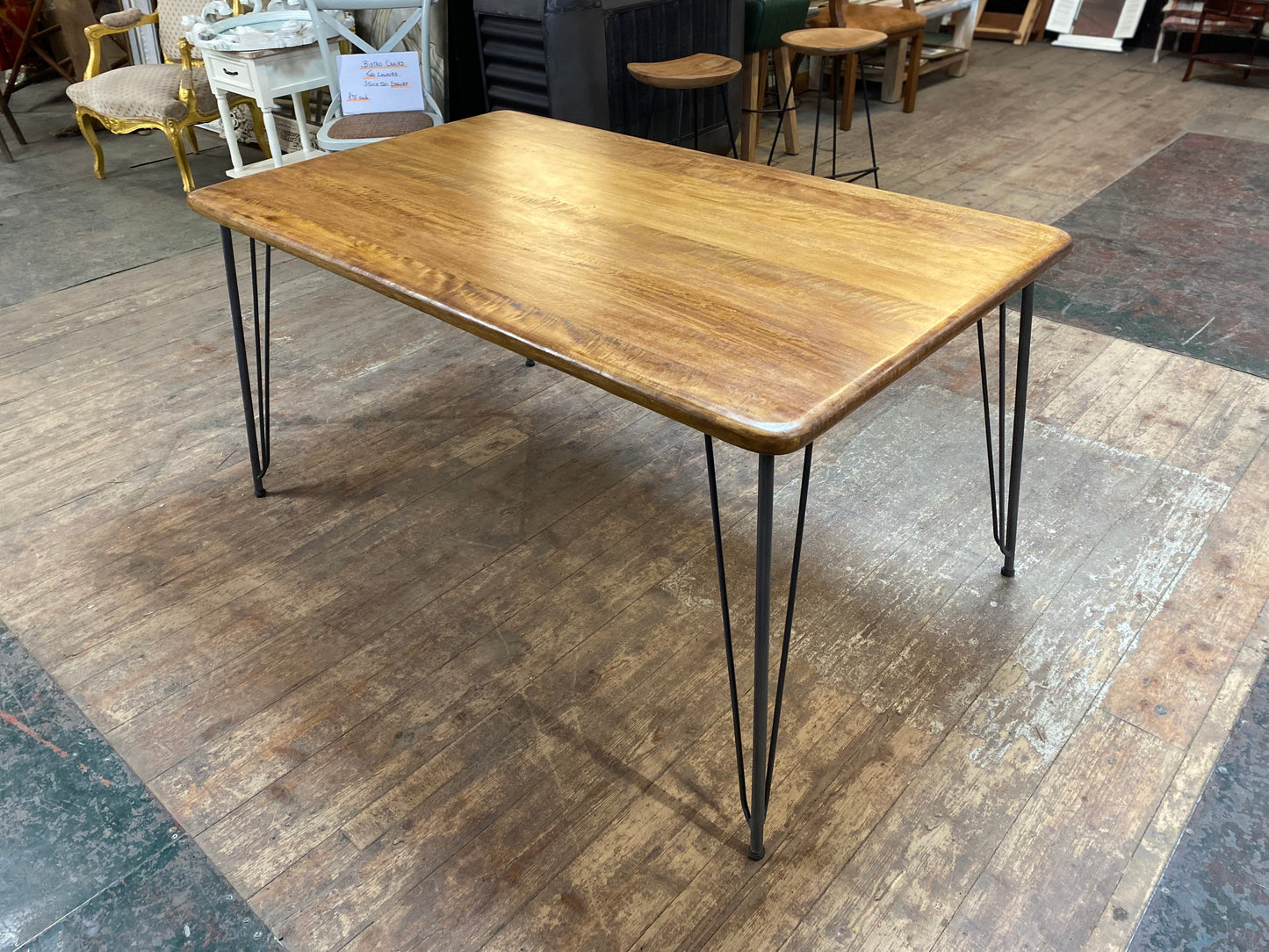 Stylish mango wood dining table with metal legs