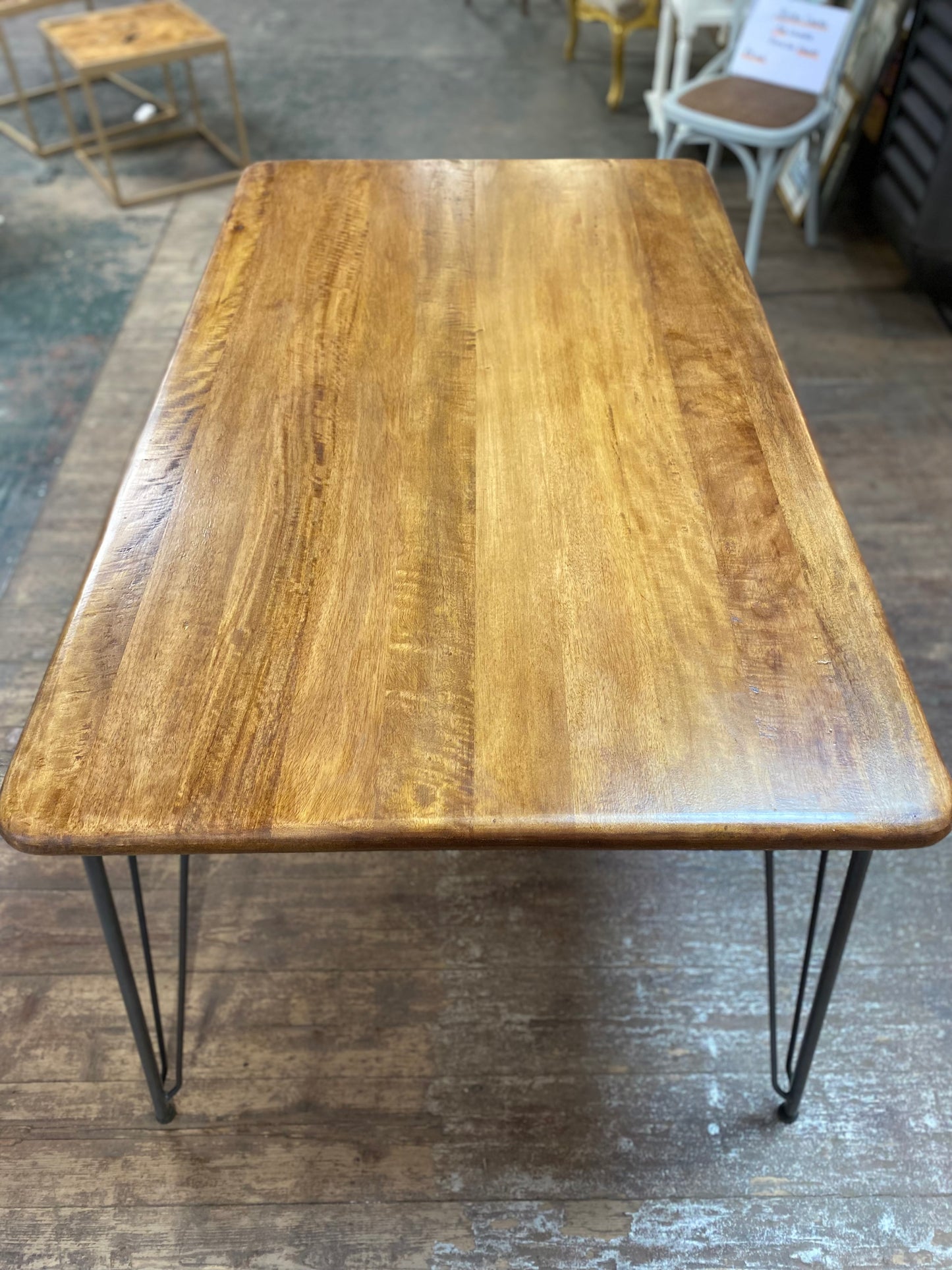 Stylish mango wood dining table with metal legs
