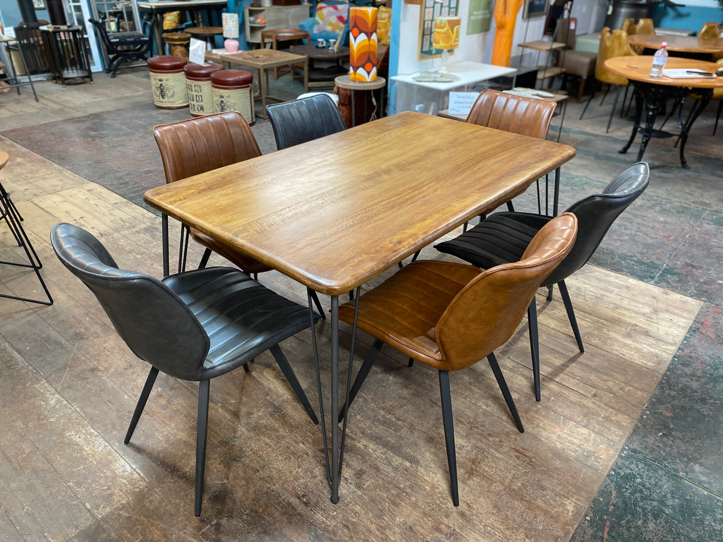 Stylish mango wood dining table with metal legs