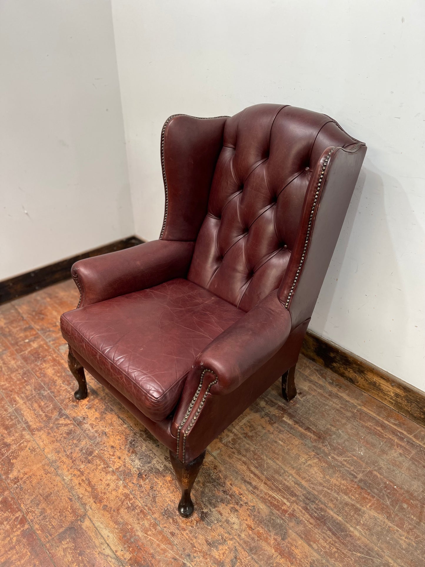 Dark red / oxblood leather wingback armchair
