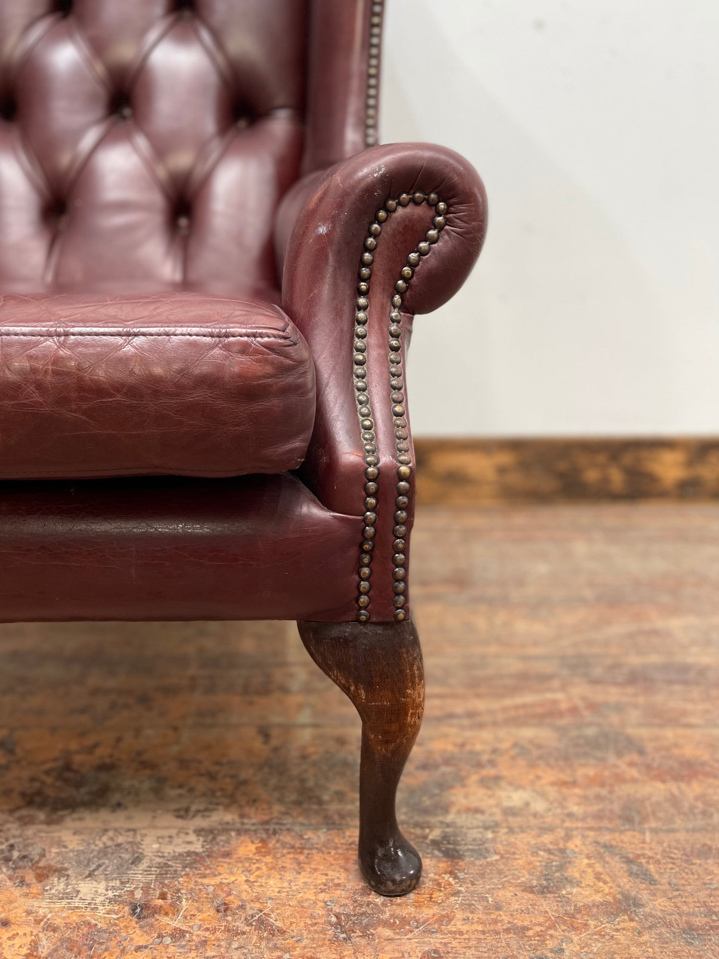 Dark red / oxblood leather wingback armchair