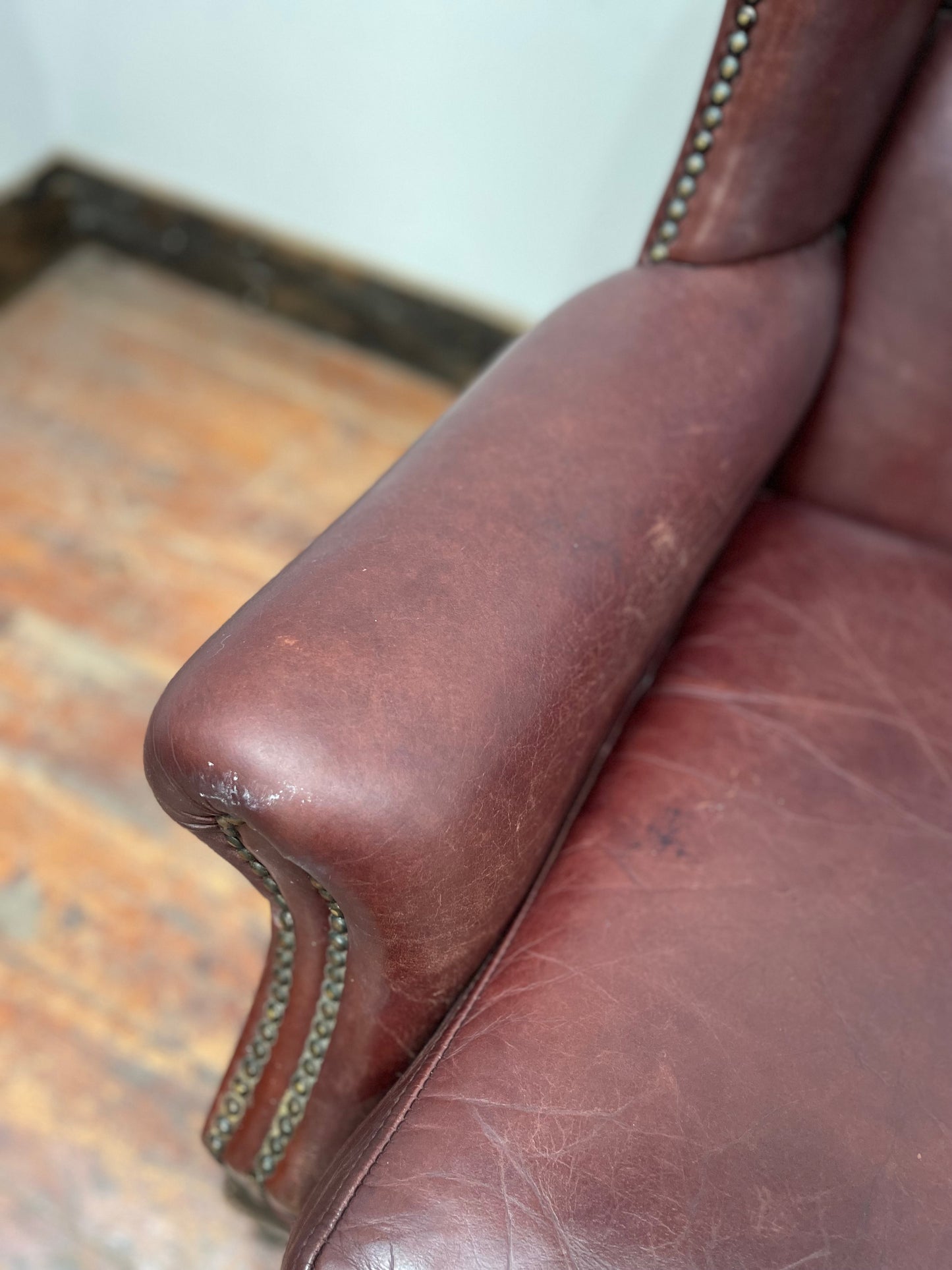 Dark red / oxblood leather wingback armchair