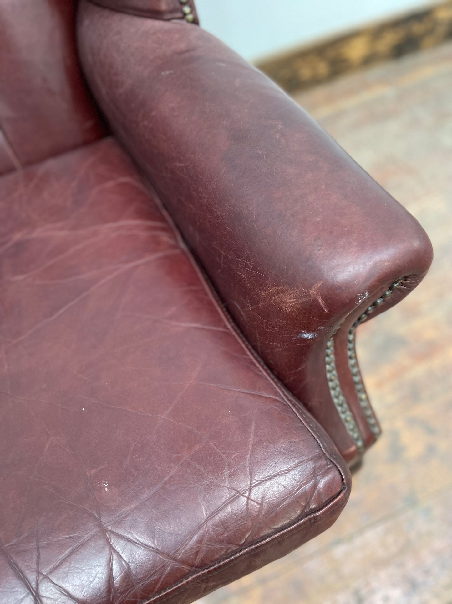 Dark red / oxblood leather wingback armchair