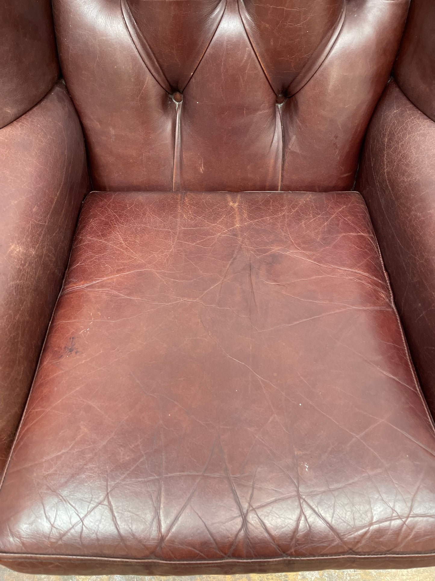 Dark red / oxblood leather wingback armchair
