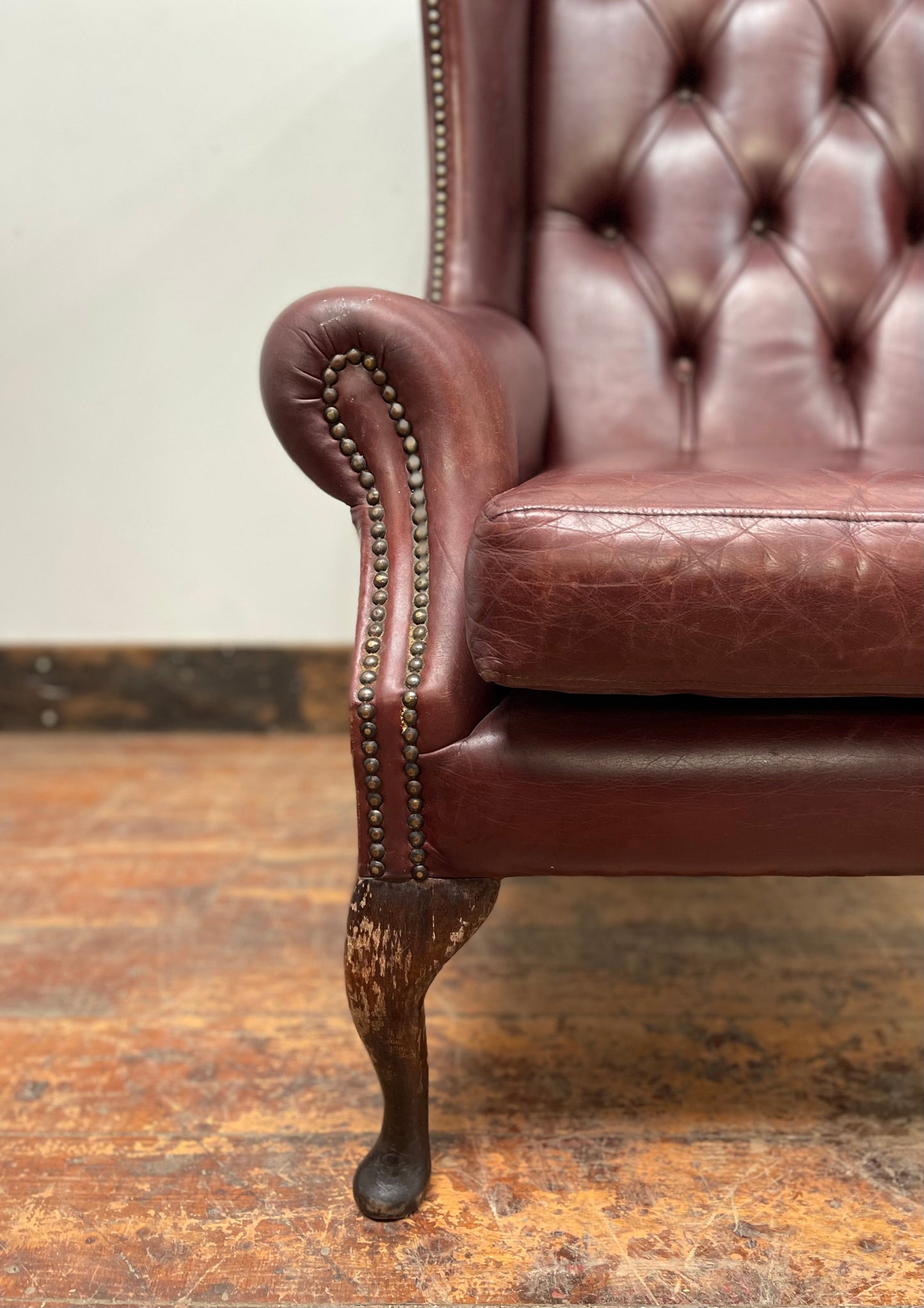 Dark red / oxblood leather wingback armchair