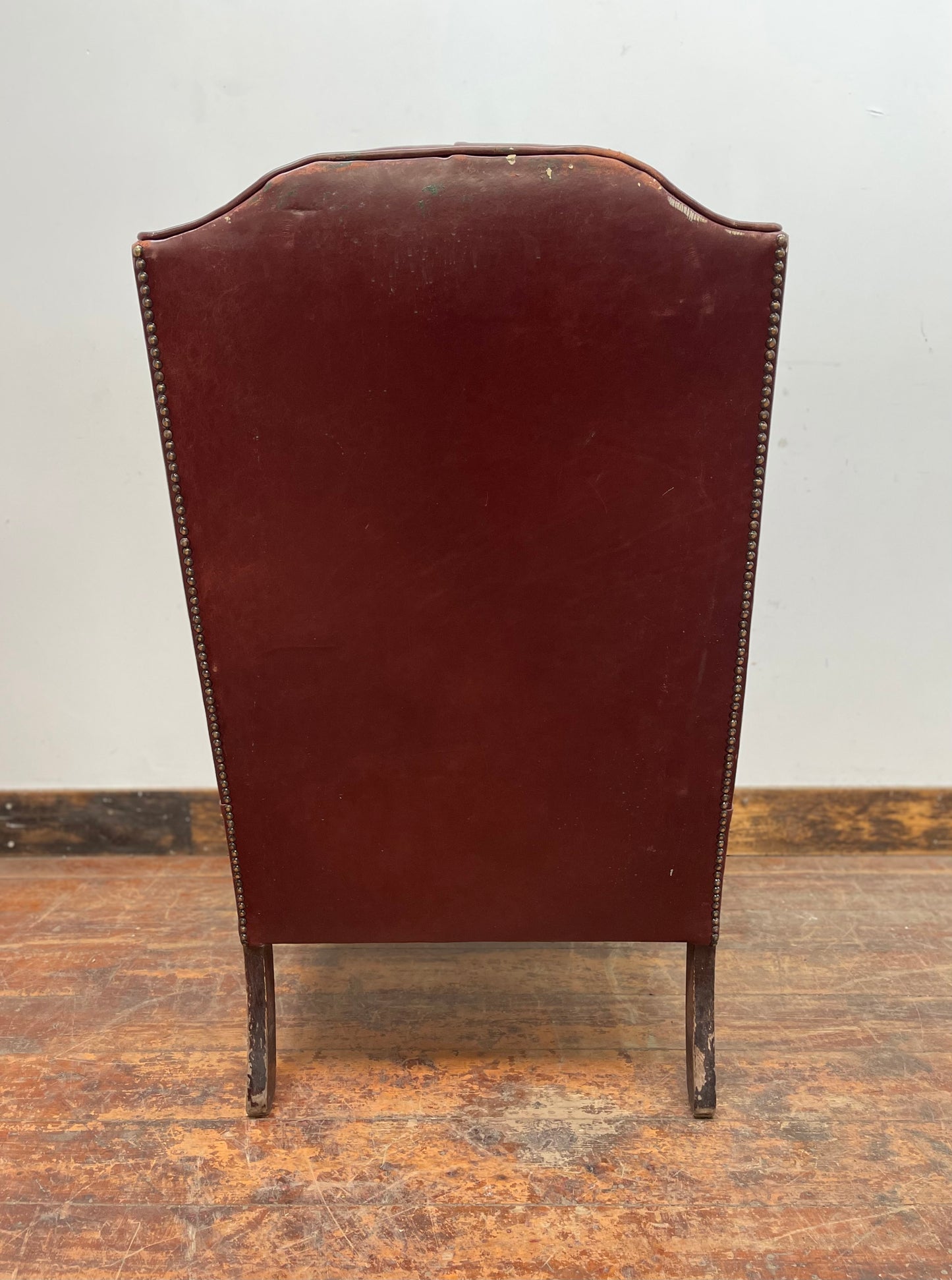 Dark red / oxblood leather wingback armchair