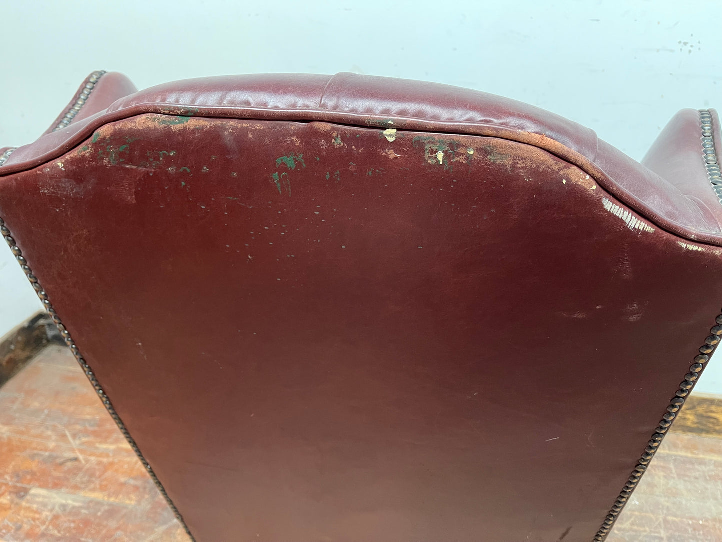 Dark red / oxblood leather wingback armchair