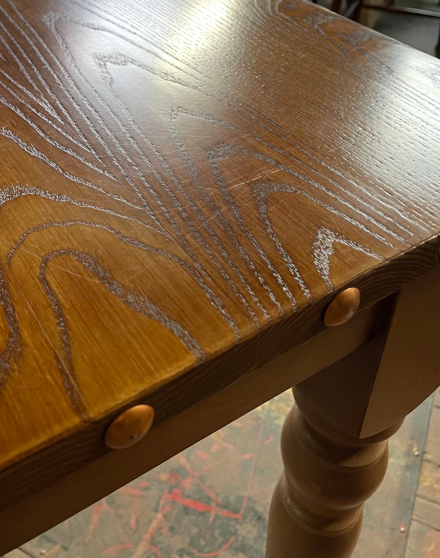 Rectangular poseur table with brass stud detail
