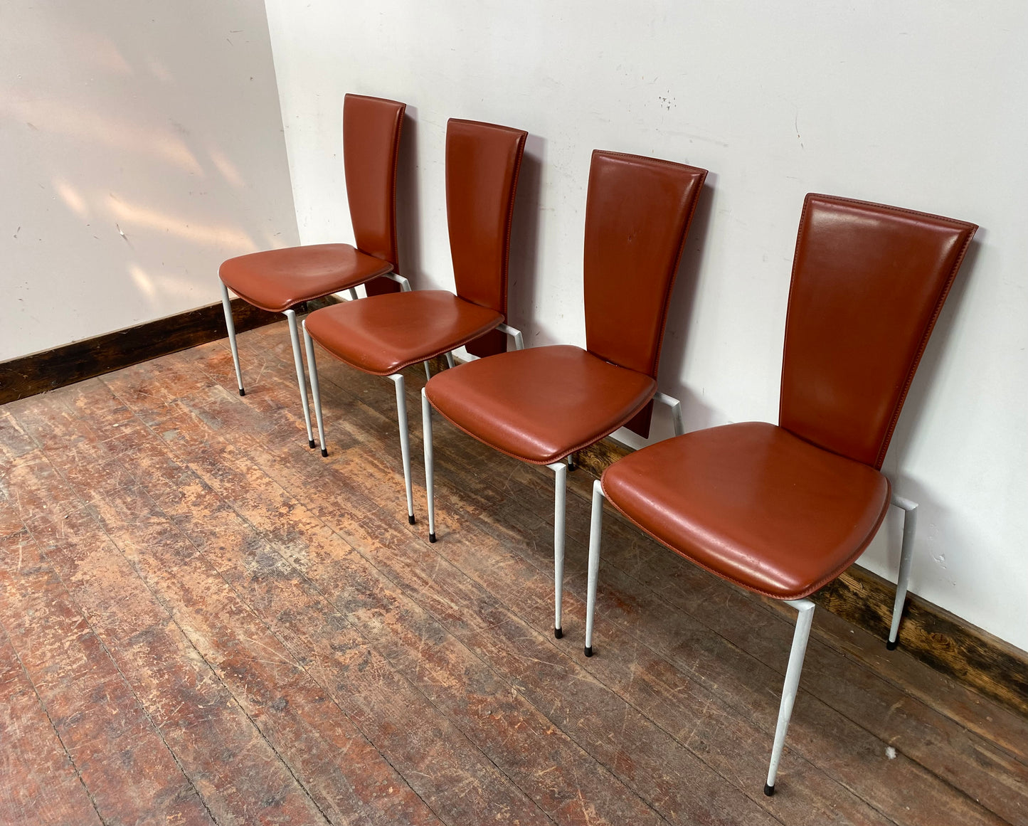 Set of four Italian leather dining chairs