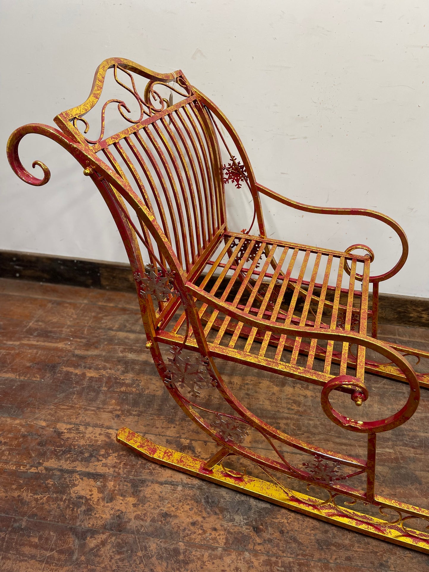 Large red and gold metal Christmas sleigh