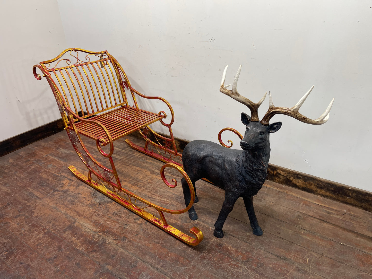 Red and gold Christmas sleigh including reindeer figure