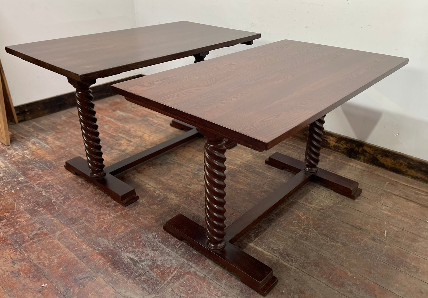 Pair of rectangular wooden pub tables with decorative legs