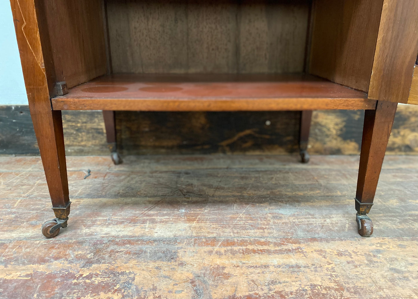 Small antique cabinet with glass door and castors