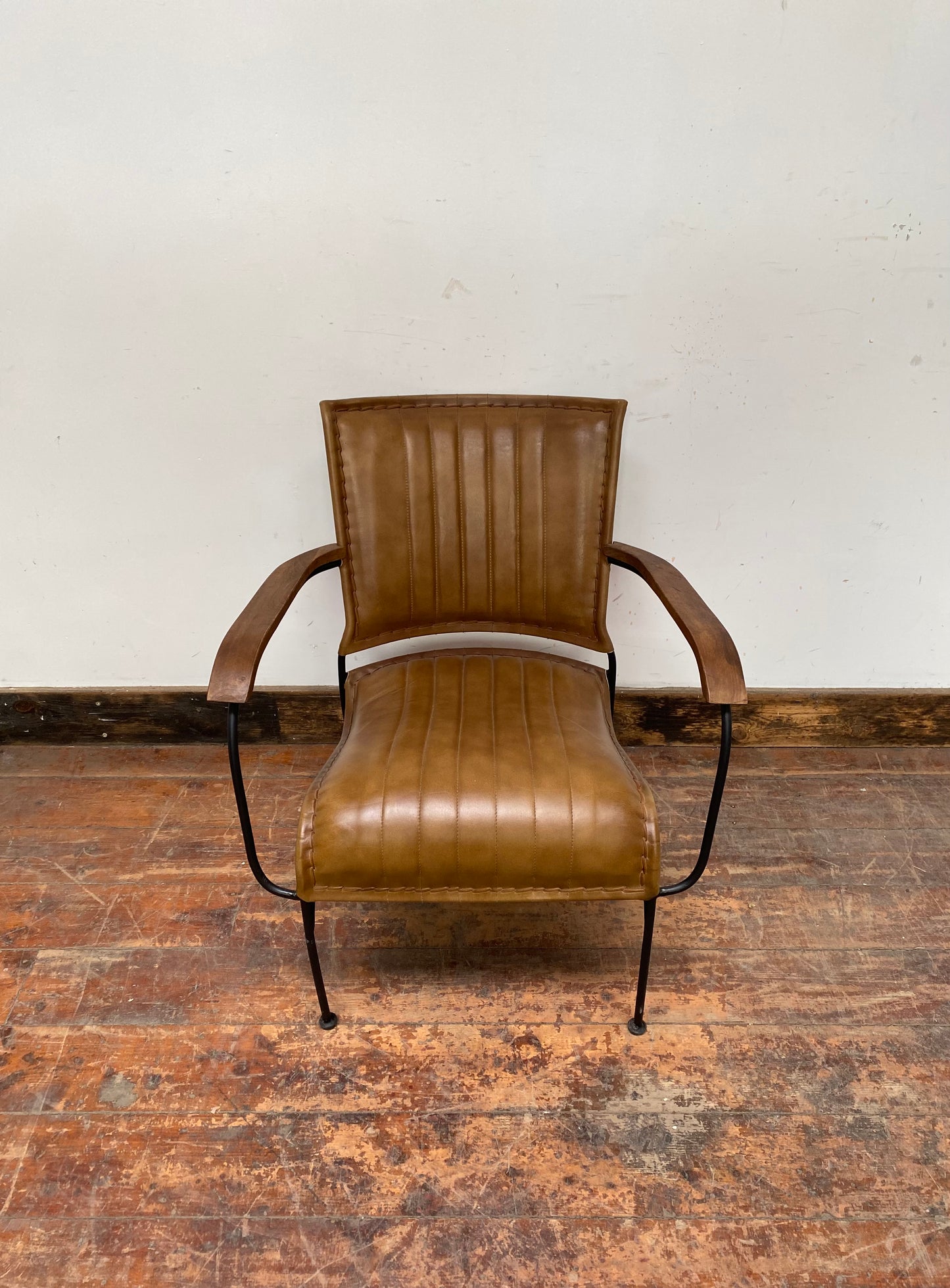 Reclined tan / brown leather armchair