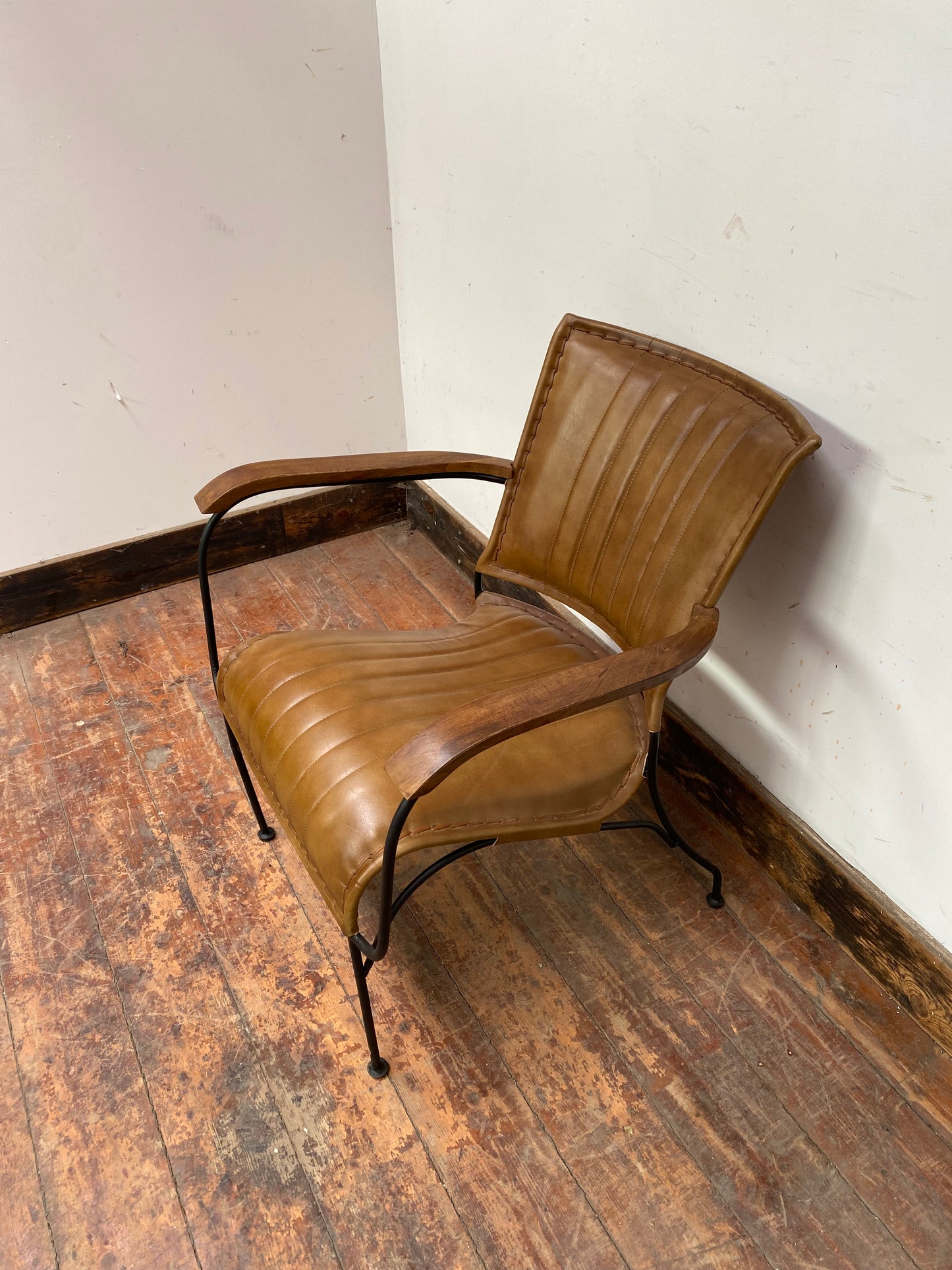 Reclined tan / brown leather armchair