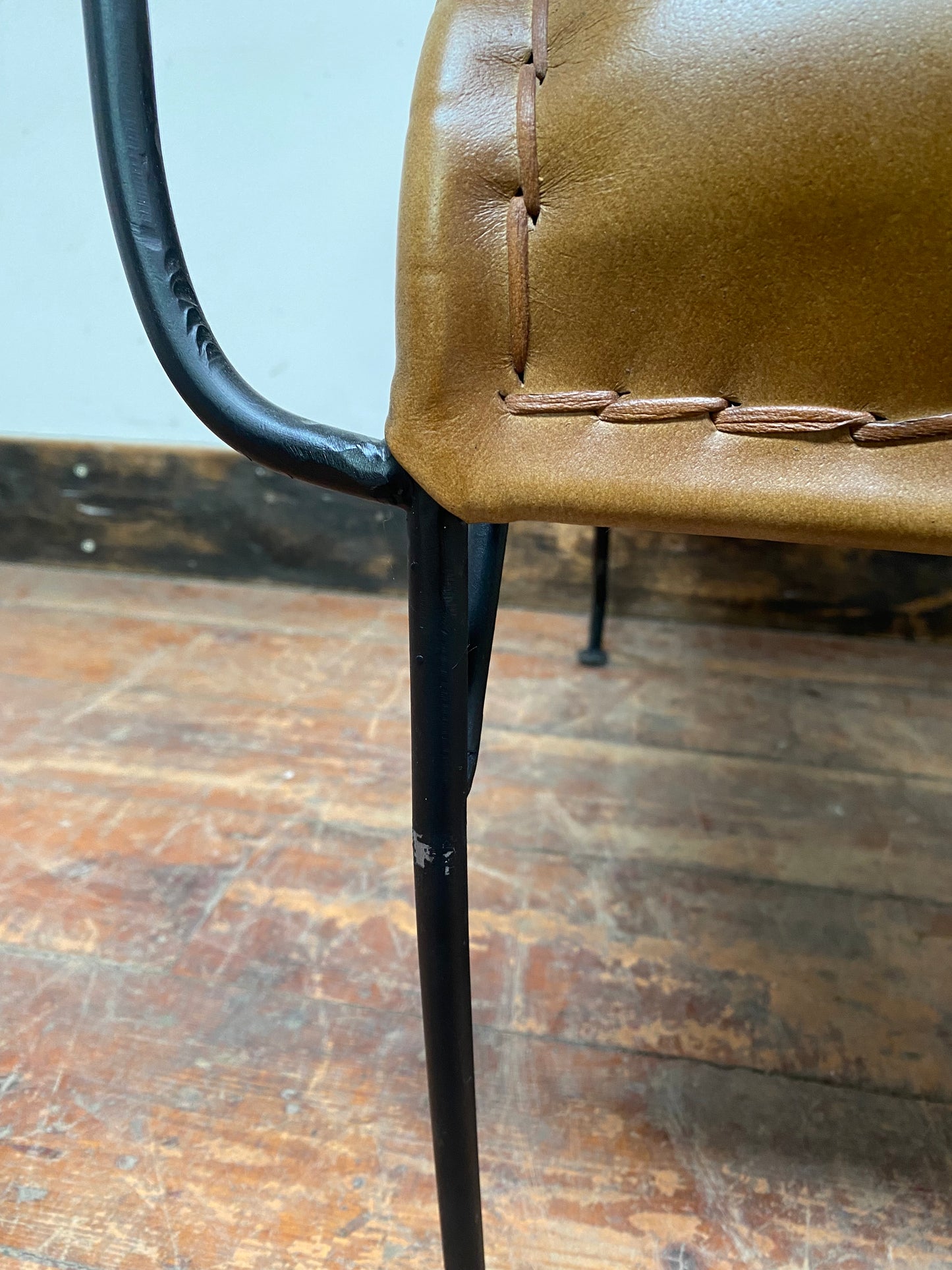 Reclined tan / brown leather armchair