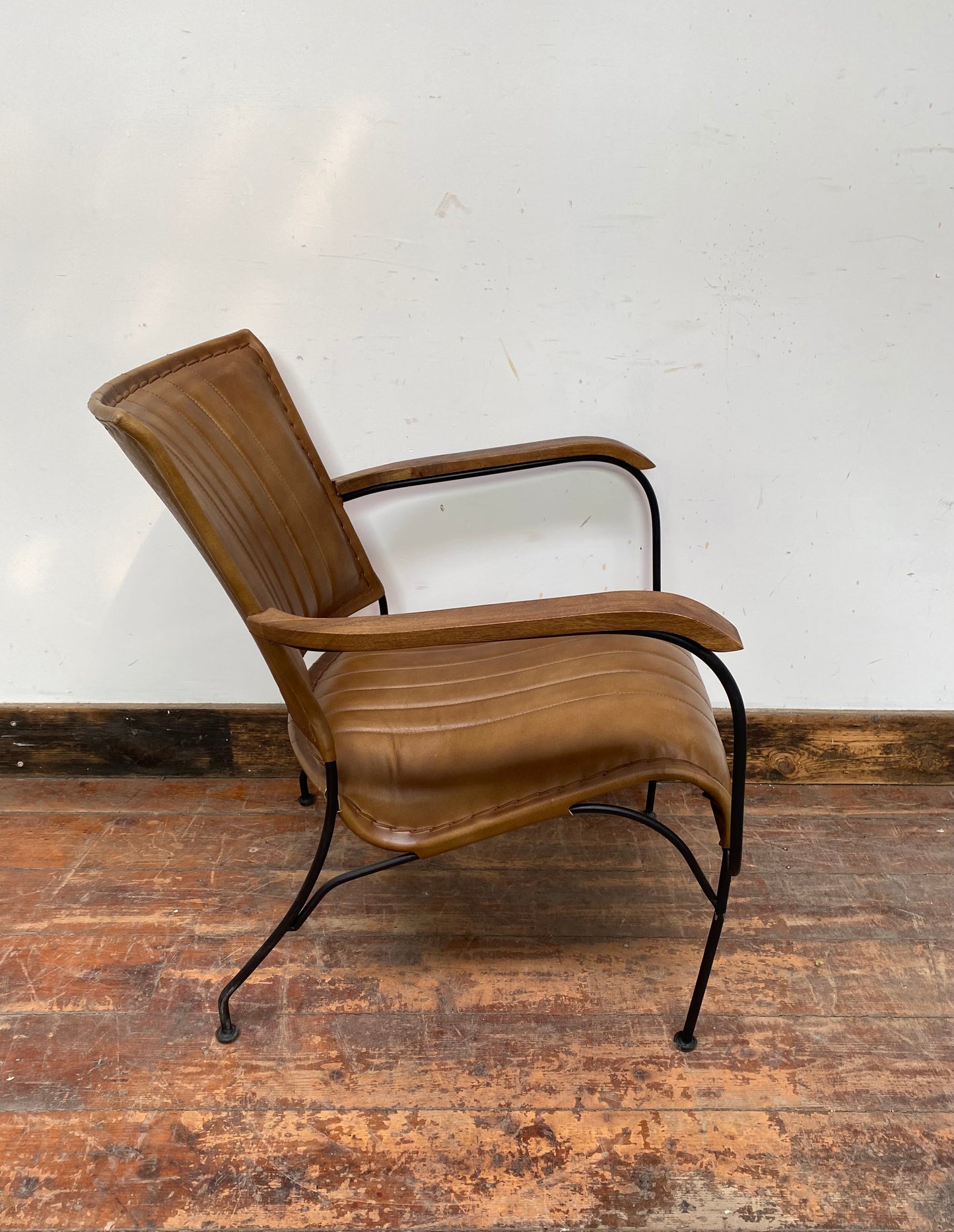Reclined tan / brown leather armchair