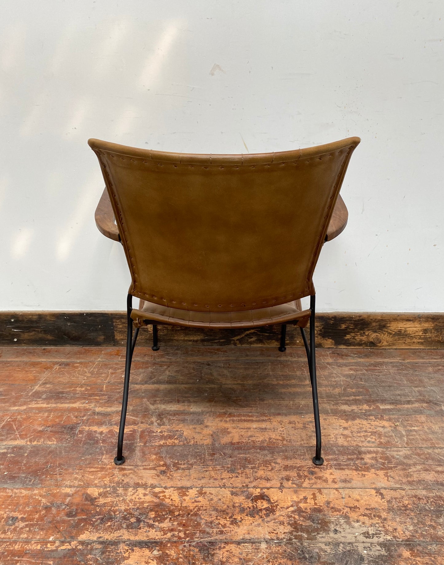 Reclined tan / brown leather armchair