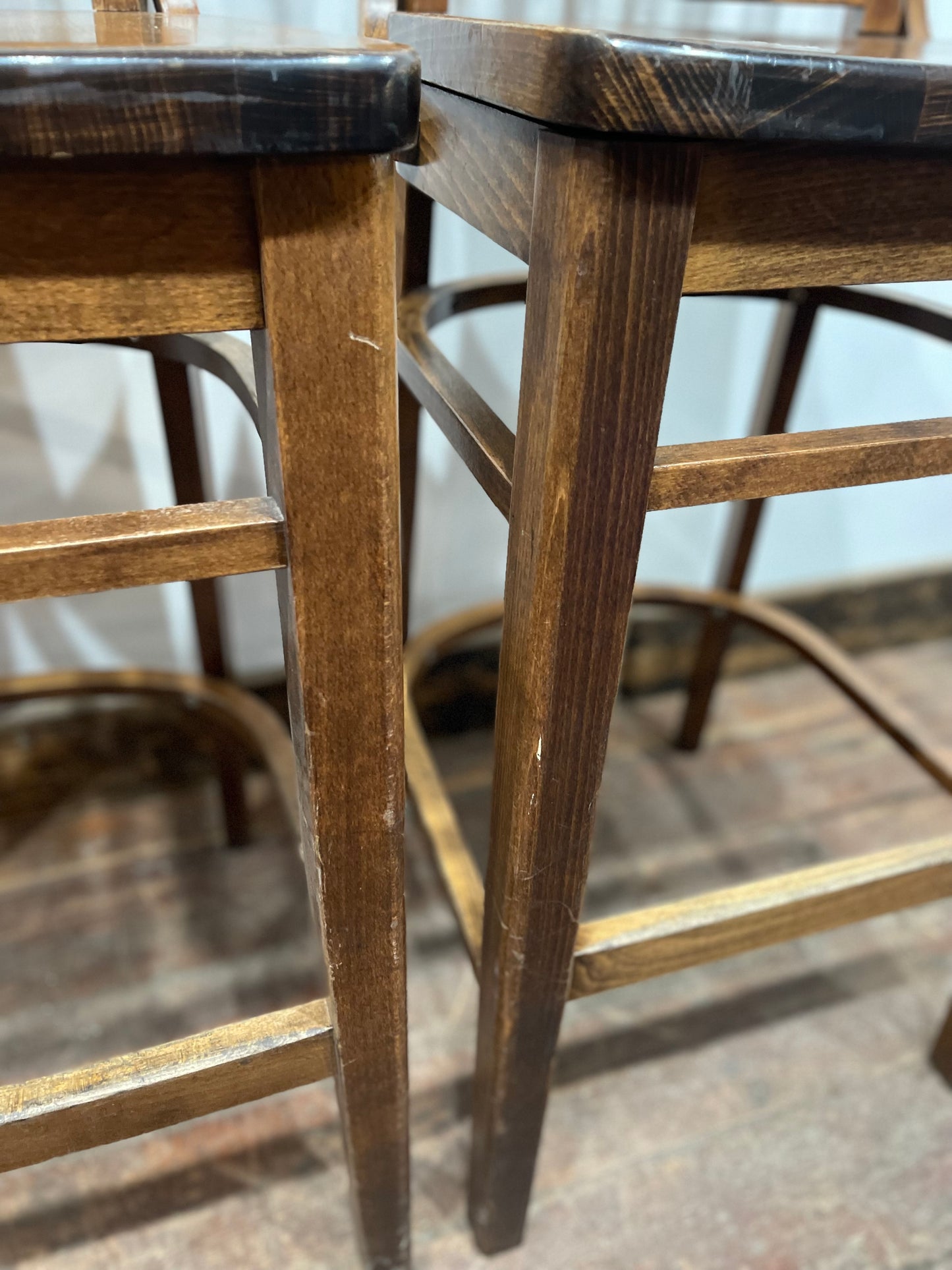 Set of five wooden pub bar stools with backrests