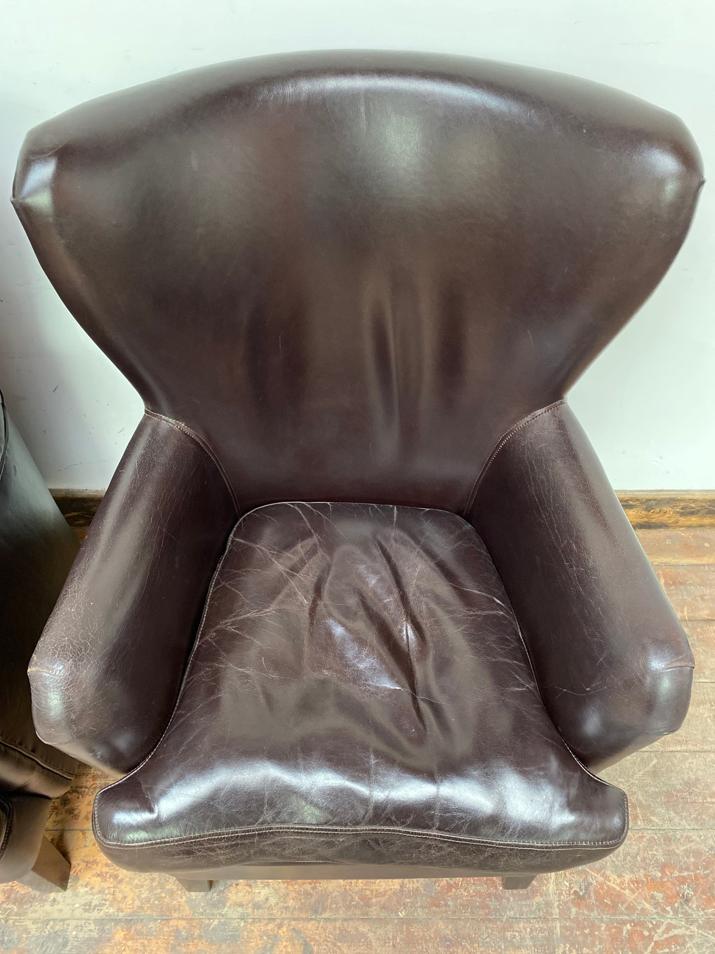Pair of matching leather wingback armchairs