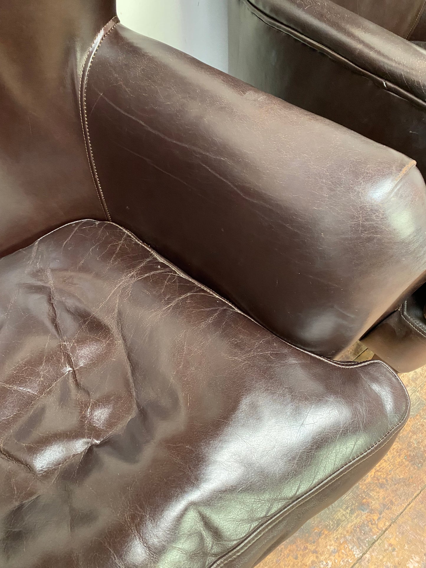 Pair of matching leather wingback armchairs
