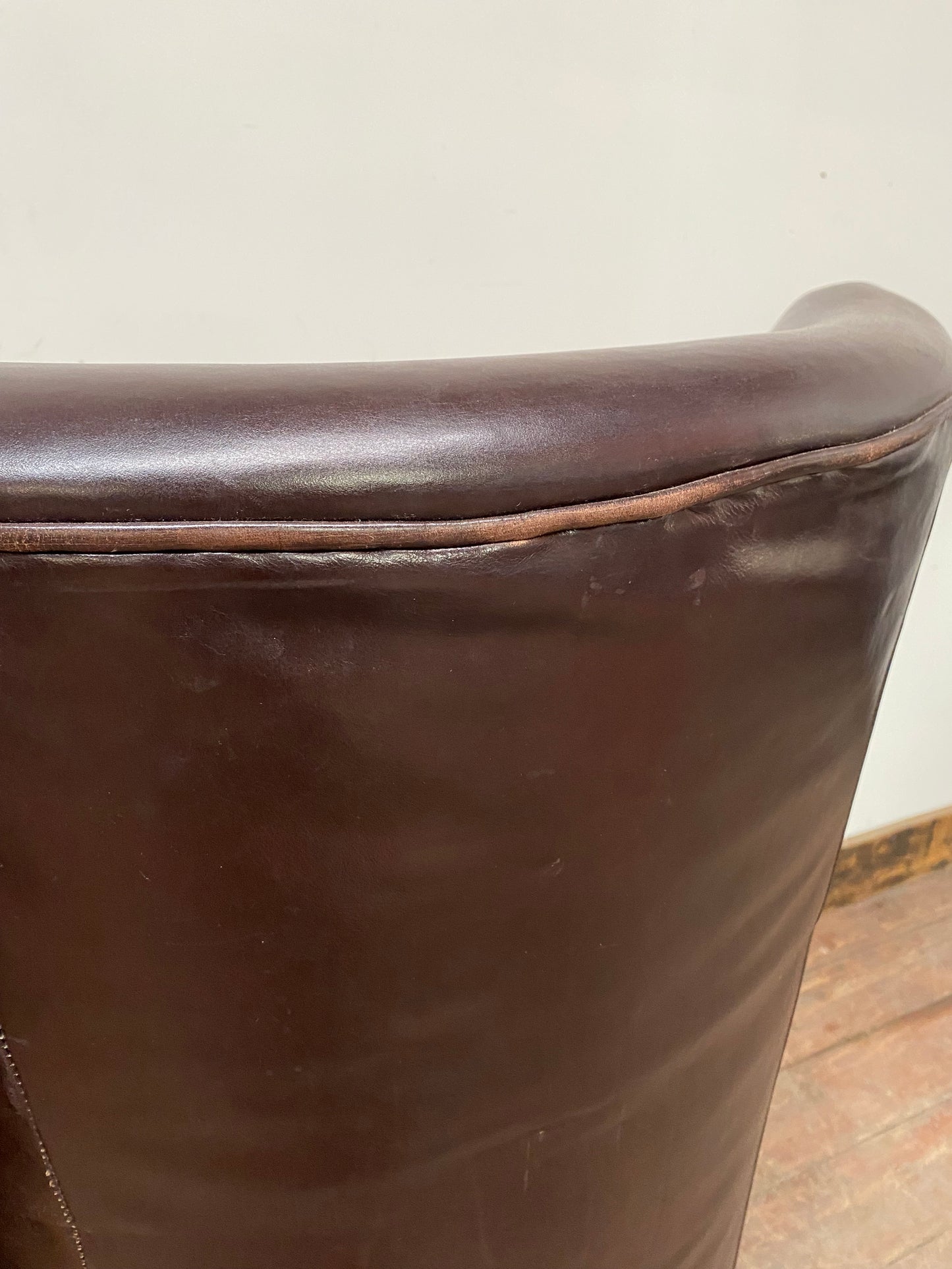 Pair of matching leather wingback armchairs