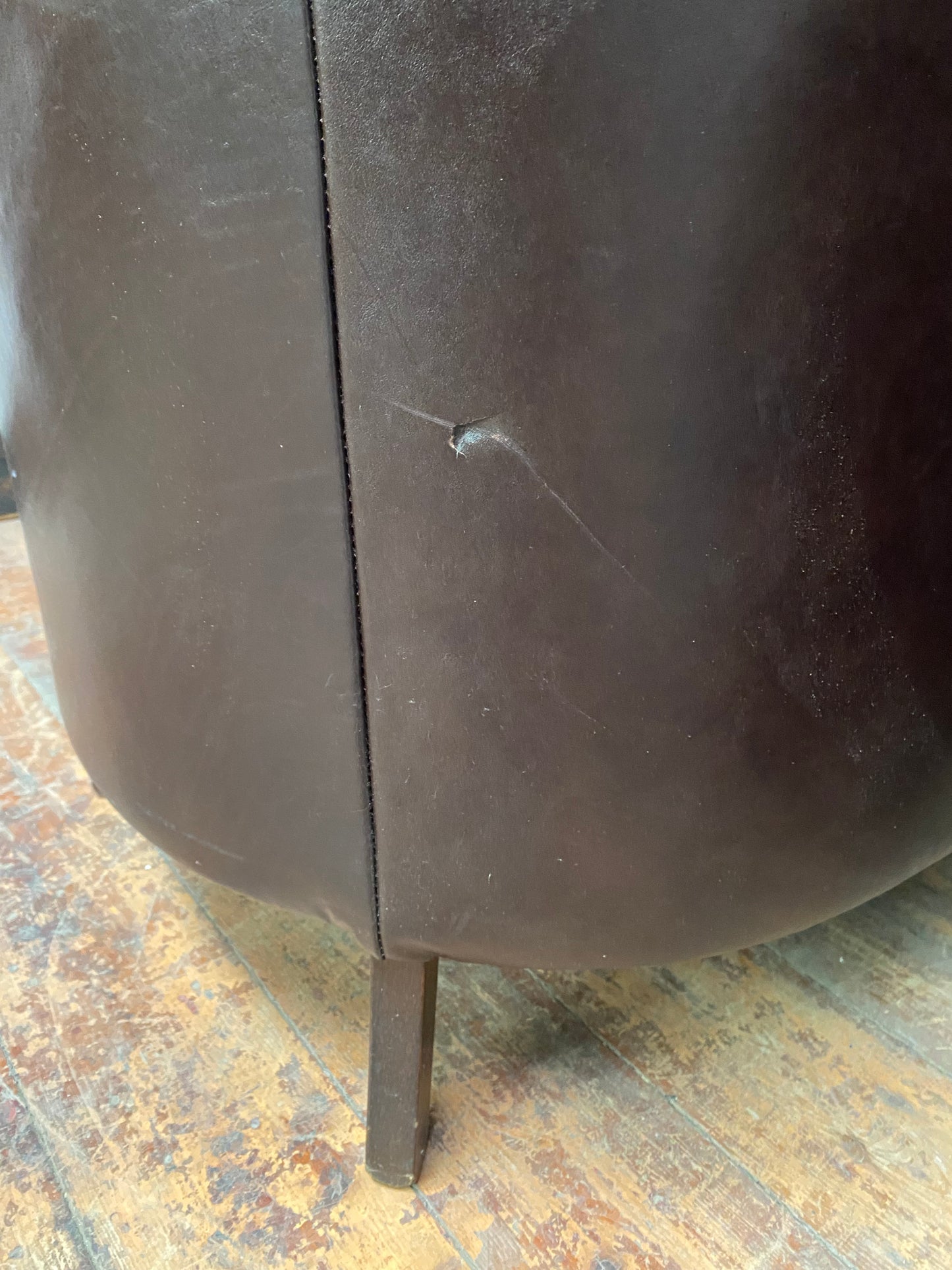 Pair of matching leather wingback armchairs