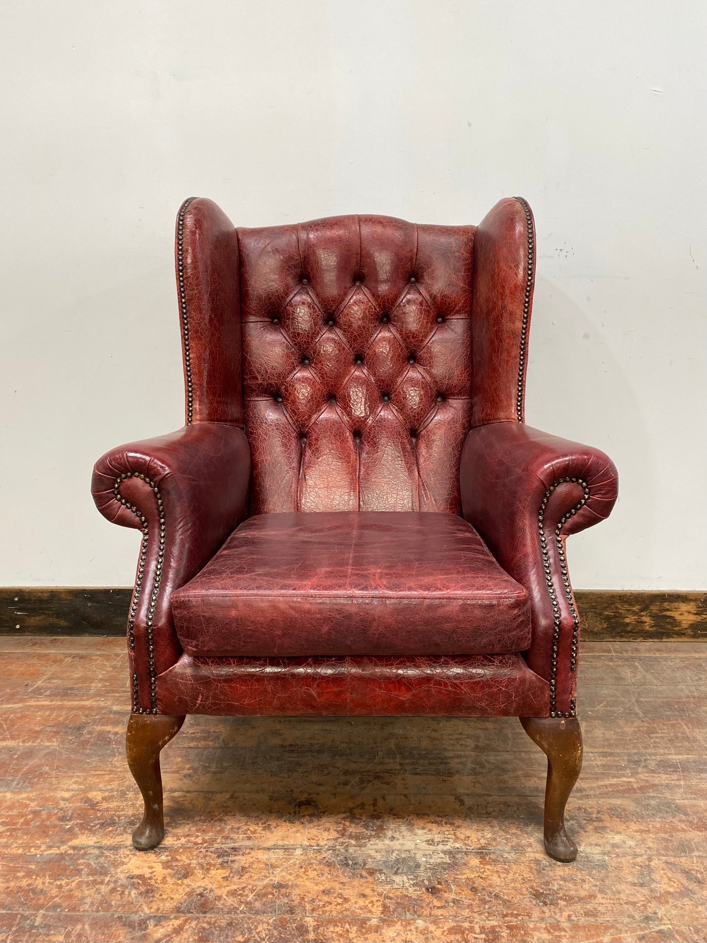 Stunning red leather wingback armchair