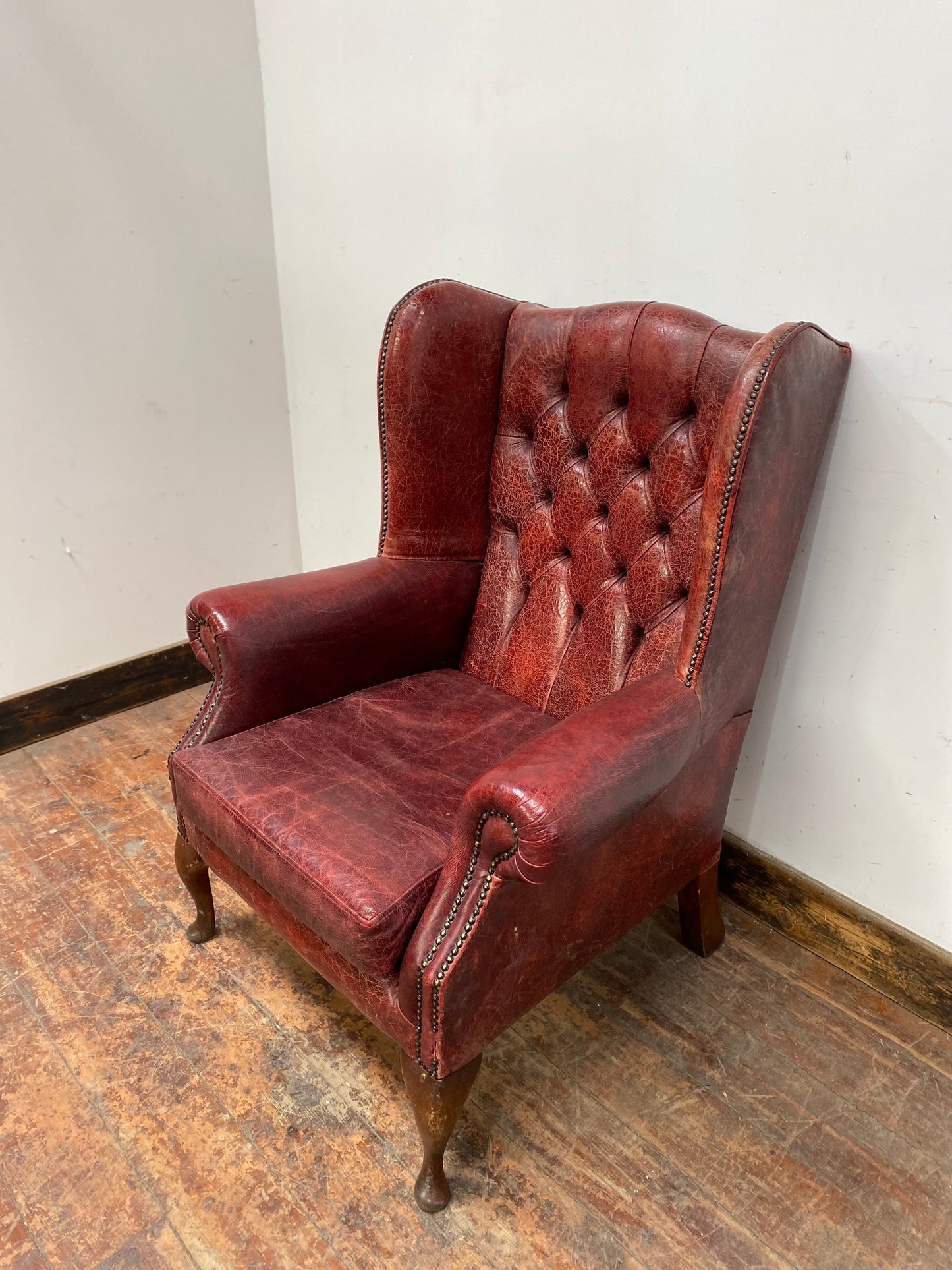 Stunning red leather wingback armchair