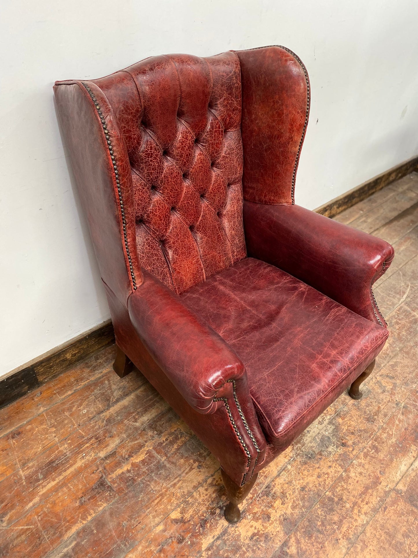 Stunning red leather wingback armchair